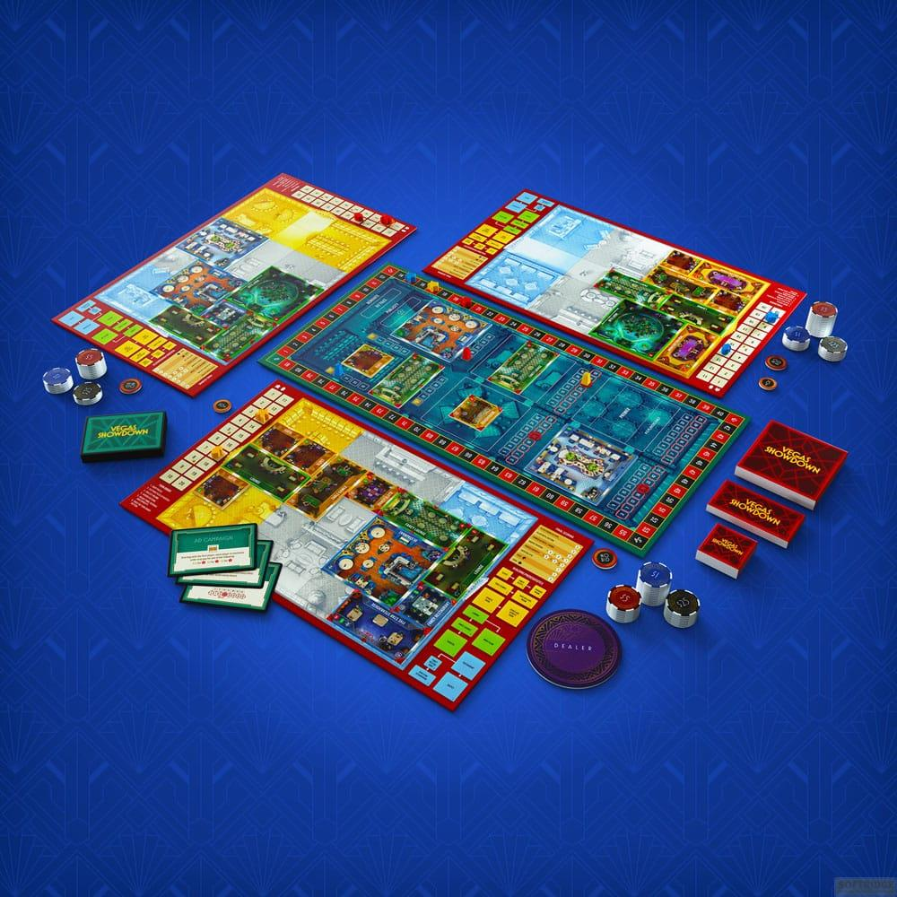 Componenti del gioco da tavolo disposti su superficie blu fantasia. Include tavole, carte e gettoni.