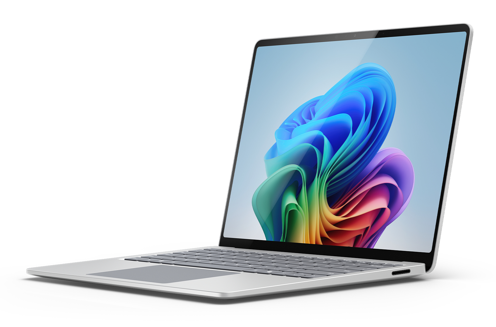 Otwarty laptop wyświetlający kolorową, abstrakcyjną tapetę na ekranie.