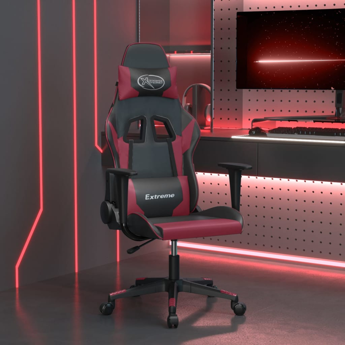 Ein schwarzer und roter Gaming-Stuhl mit Kopfstütze und Lendenkissen.