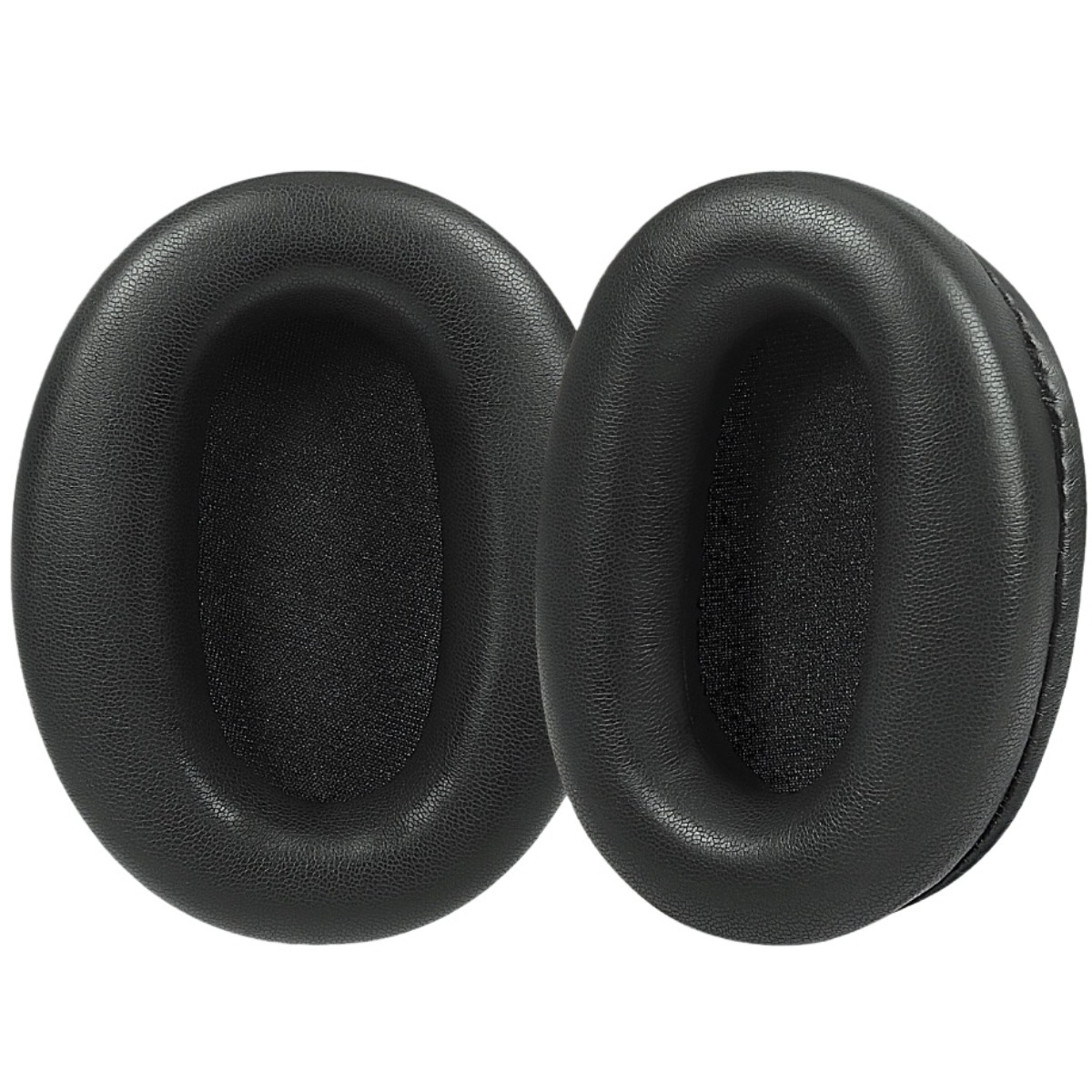 Dos almohadillas ovaladas negras de cuero sintético, una al lado de la otra.