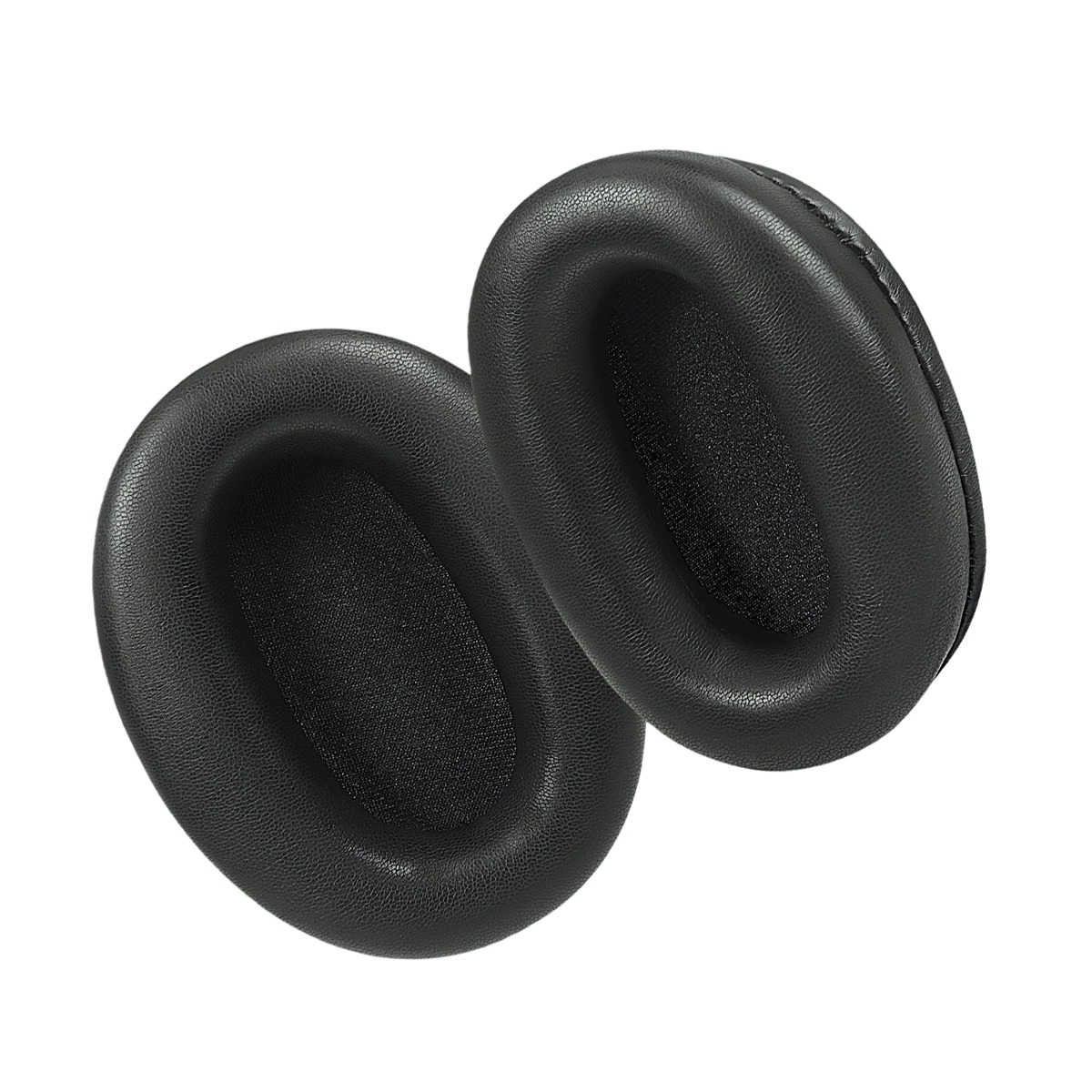 Dos almohadillas negras y ovaladas para auriculares, una al lado de la otra.
