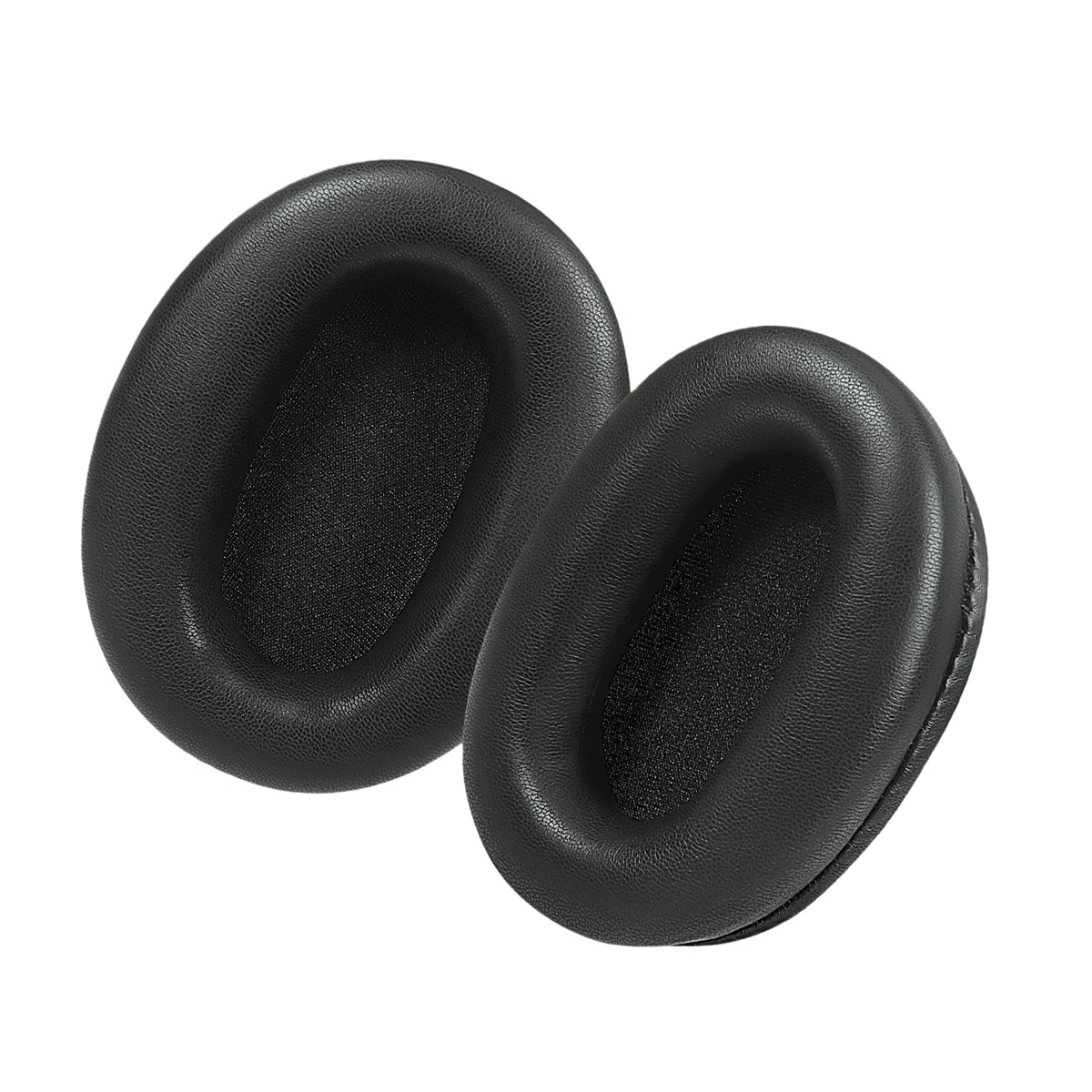 Dos almohadillas negras para auriculares sobre fondo blanco.