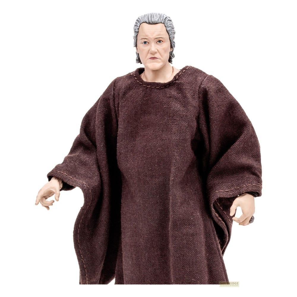 Eine Figur mit grauem Haar trägt eine braune Robe.