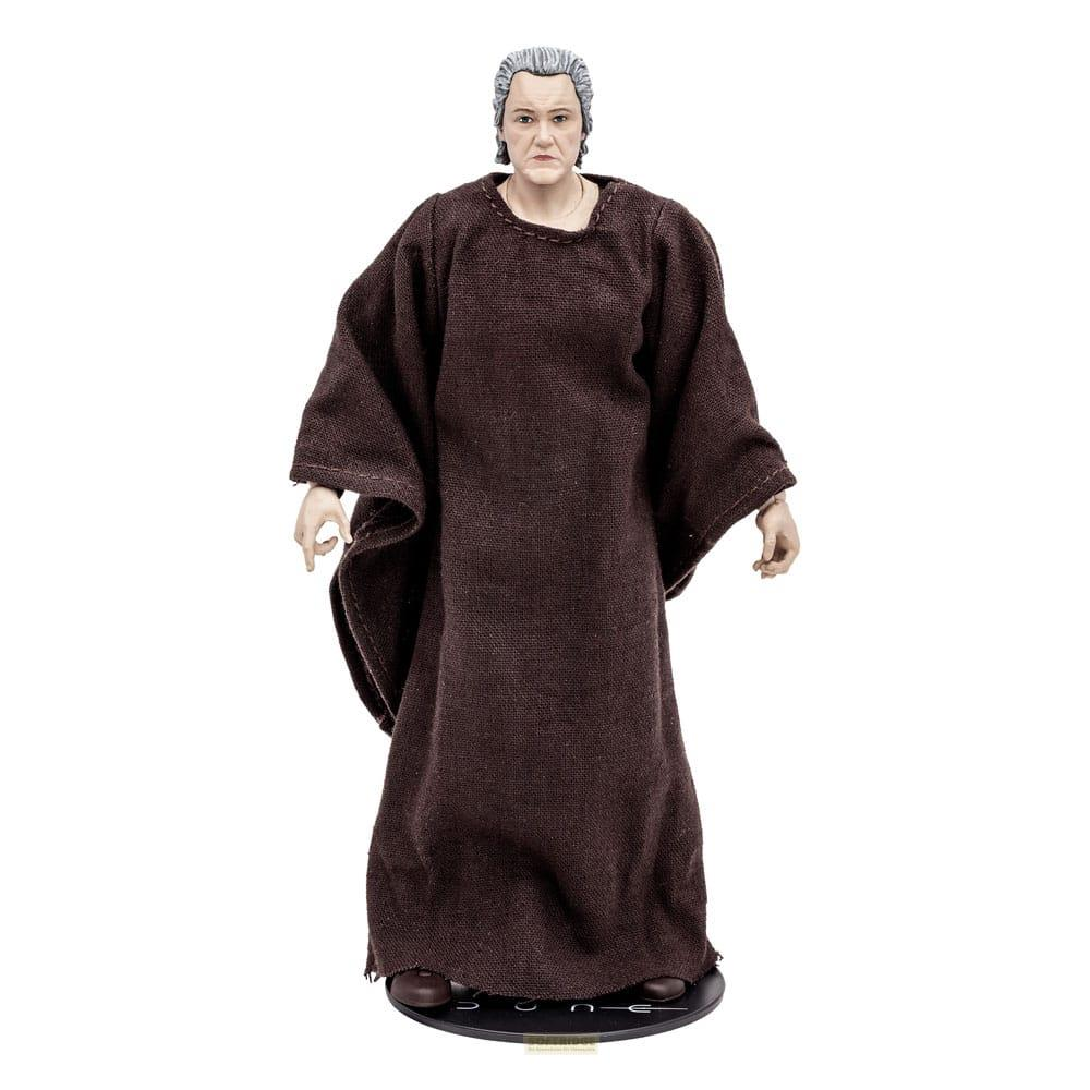 Eine männliche Figur in braunem Gewand und grauem Haar steht auf einem schwarzen Sockel.
