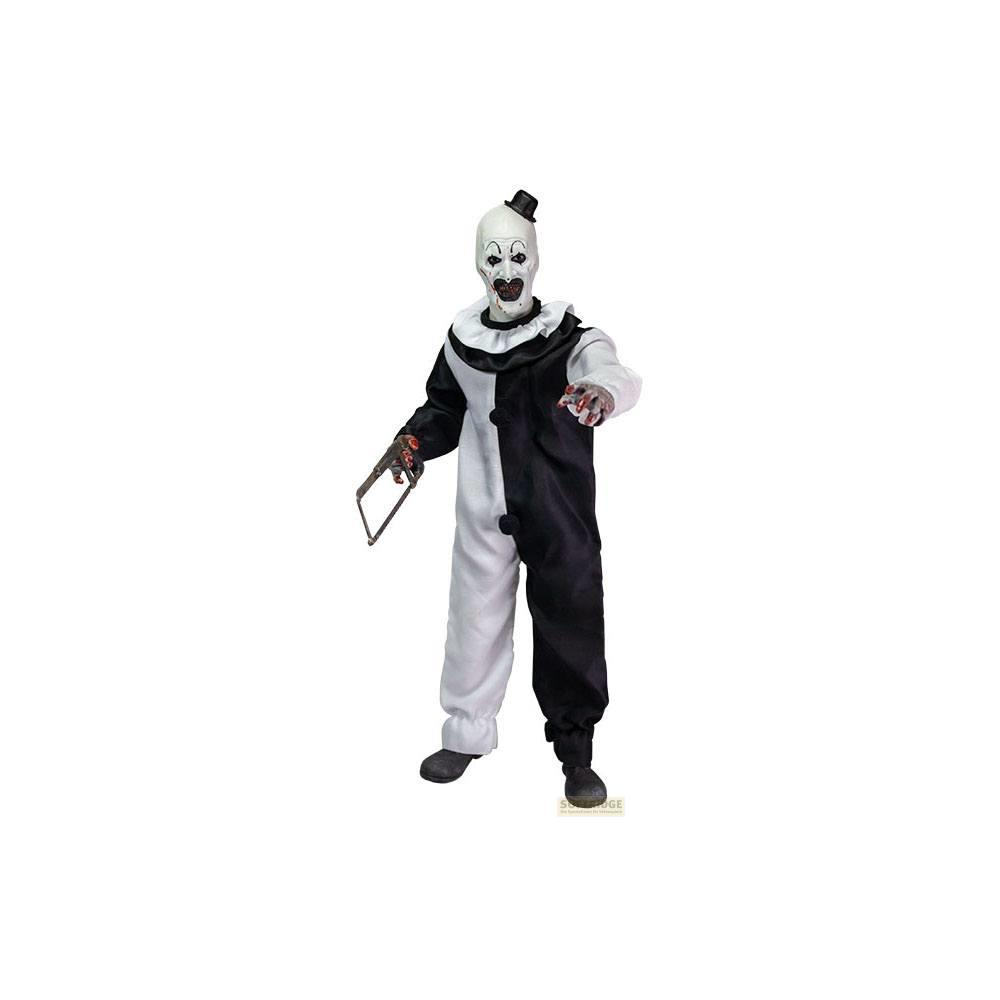 Ein Clown mit weißem Gesicht, schwarzem Zylinder und einem Bügelsäge-Werkzeug.