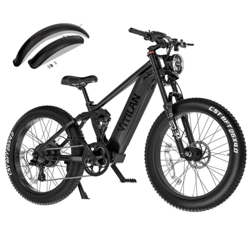 Bicicletta elettrica nera con pneumatici larghi, sospensioni e parafanghi.