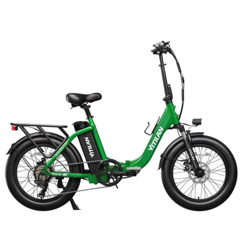 Una e-bike pieghevole verde con pneumatici larghi e portapacchi.