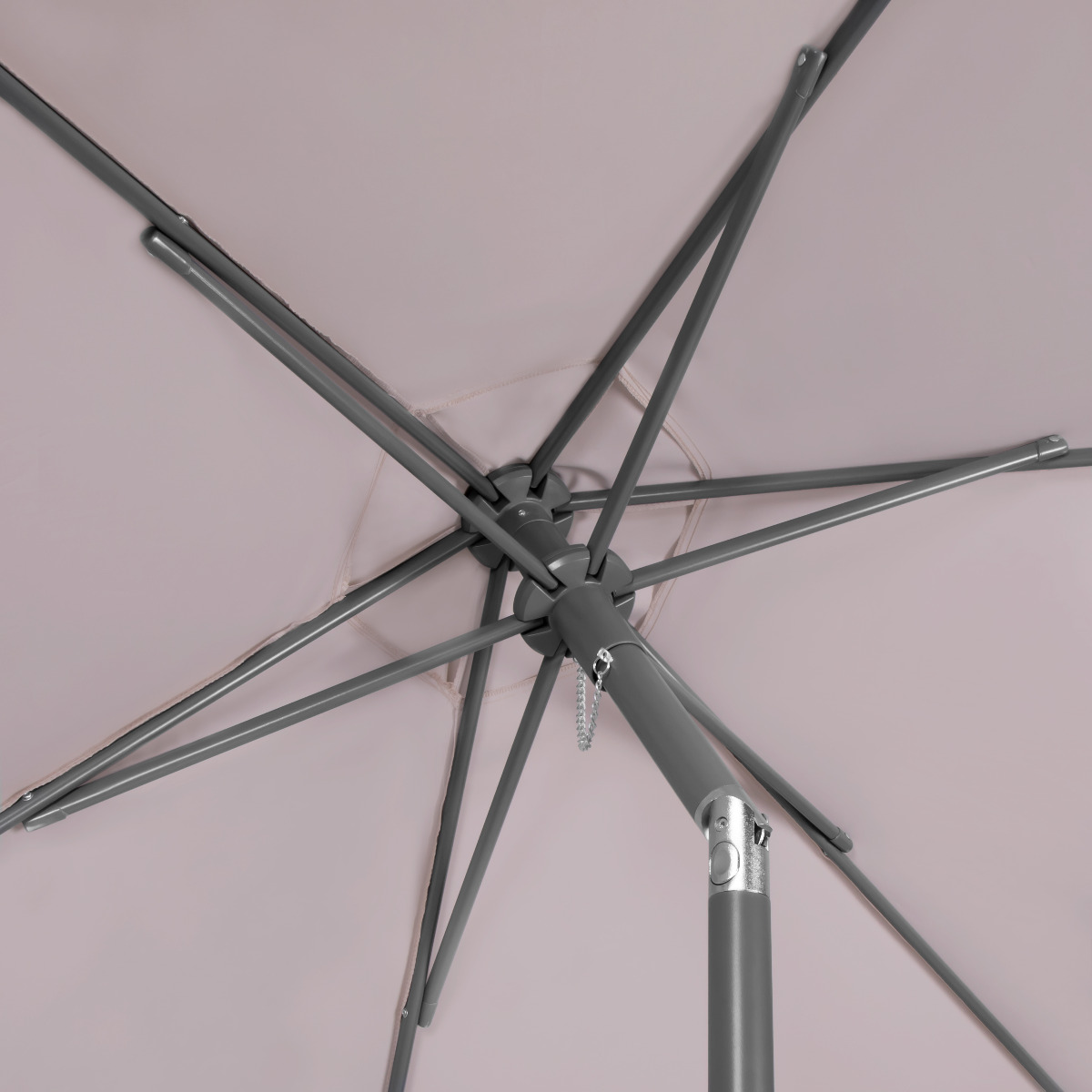 Underside of a beige umbrella with a grey metal frame and spokes.