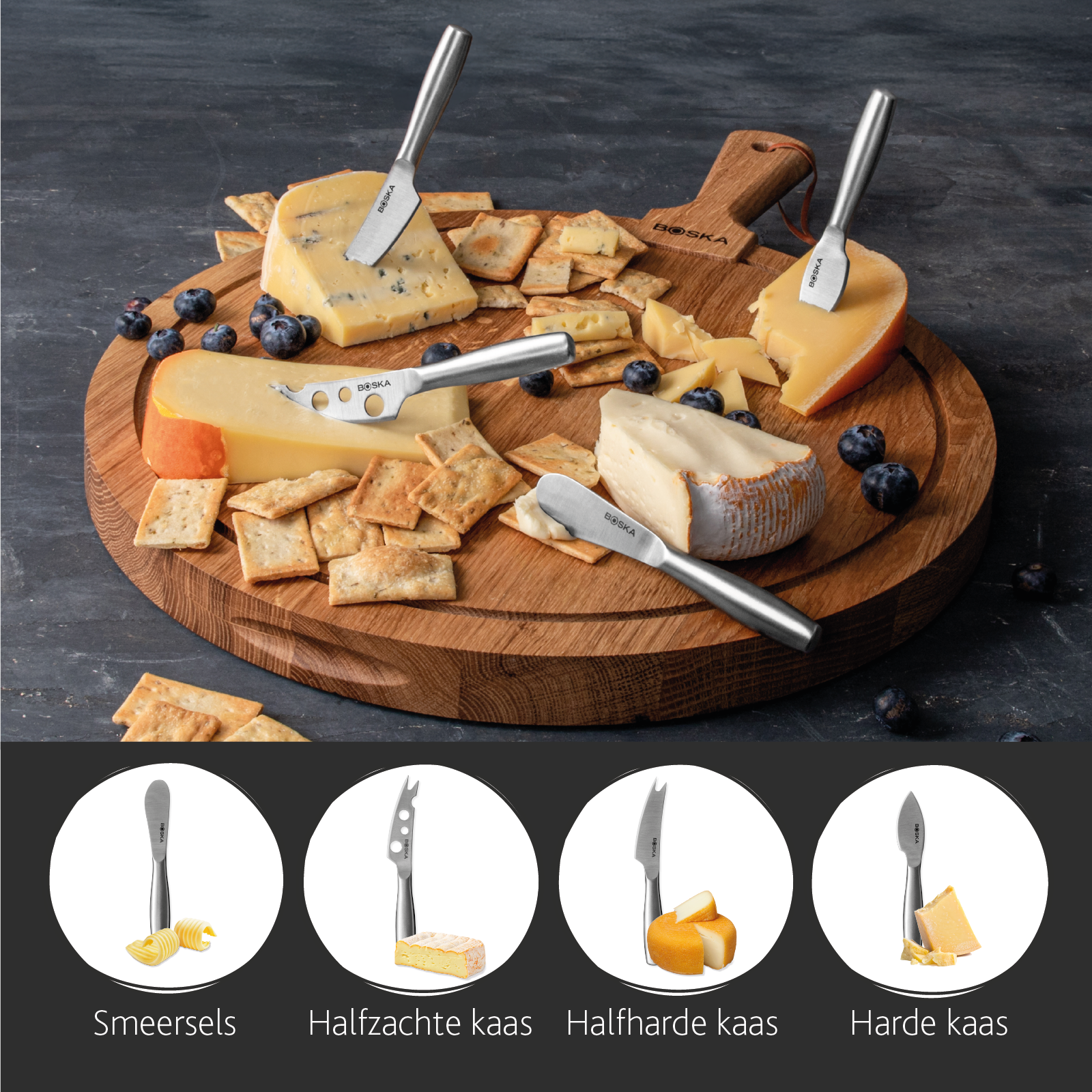 Cheese board with various cheeses, crackers and berries.