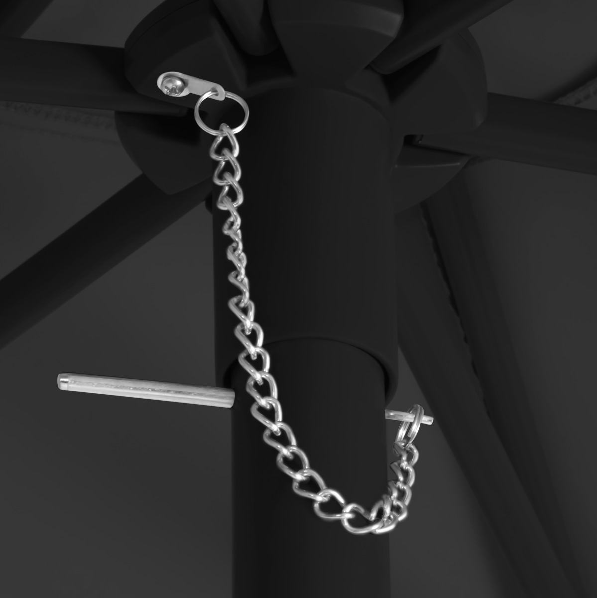A black pole with a silver chain and pin.