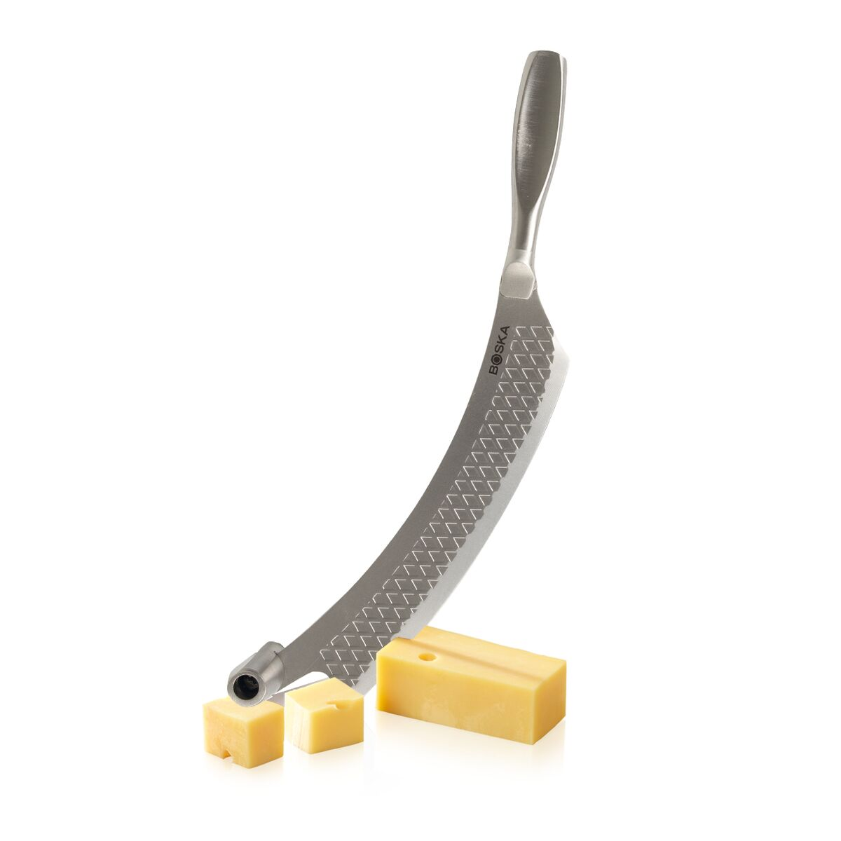 A curved cheese slicer with a diamond pattern and two cheese cubes.