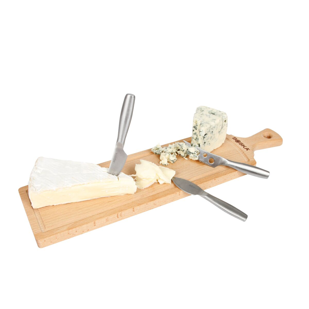 Brie and blue cheese on a wooden board with three knives.