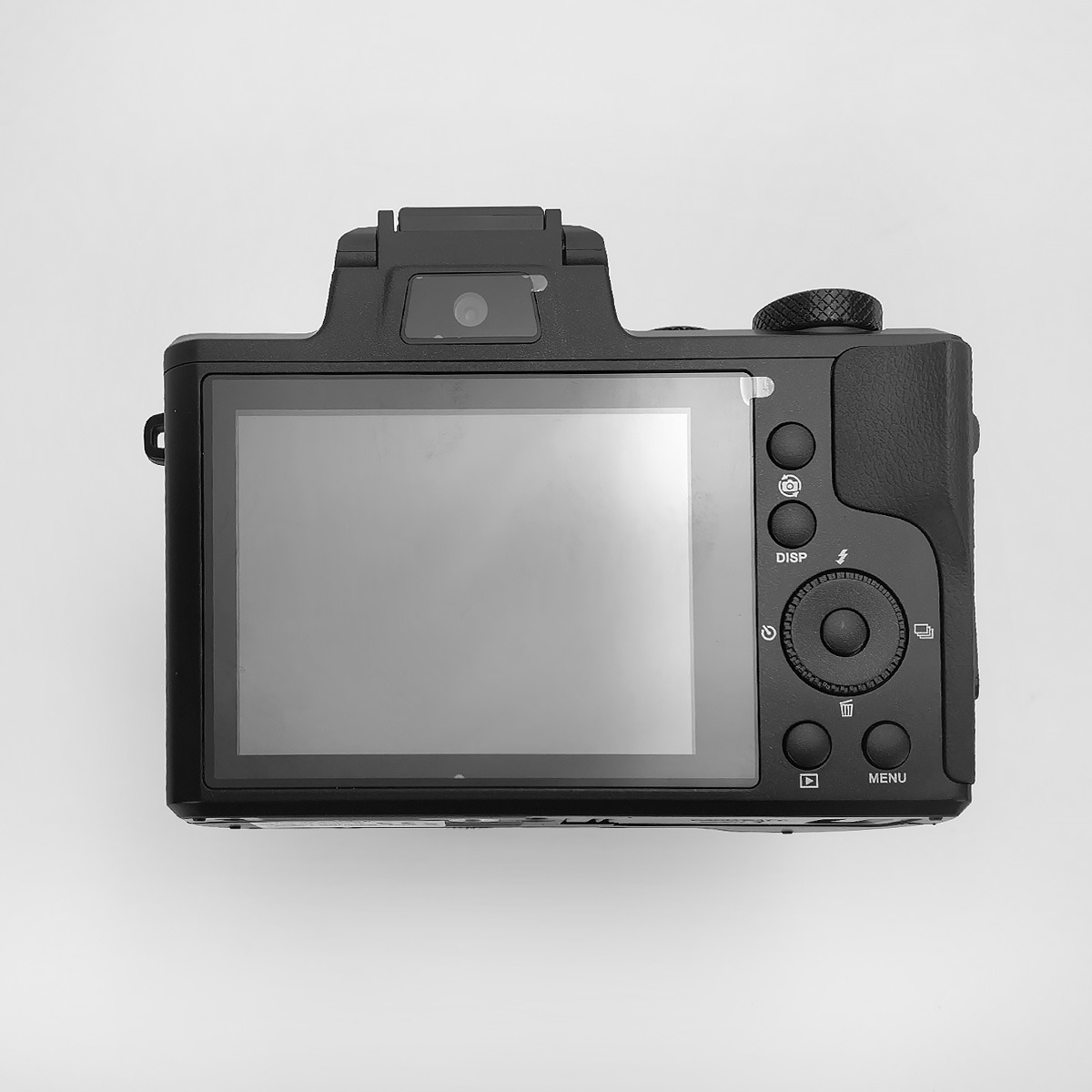 Tył aparatu cyfrowego z dużym ekranem i przyciskami sterującymi.