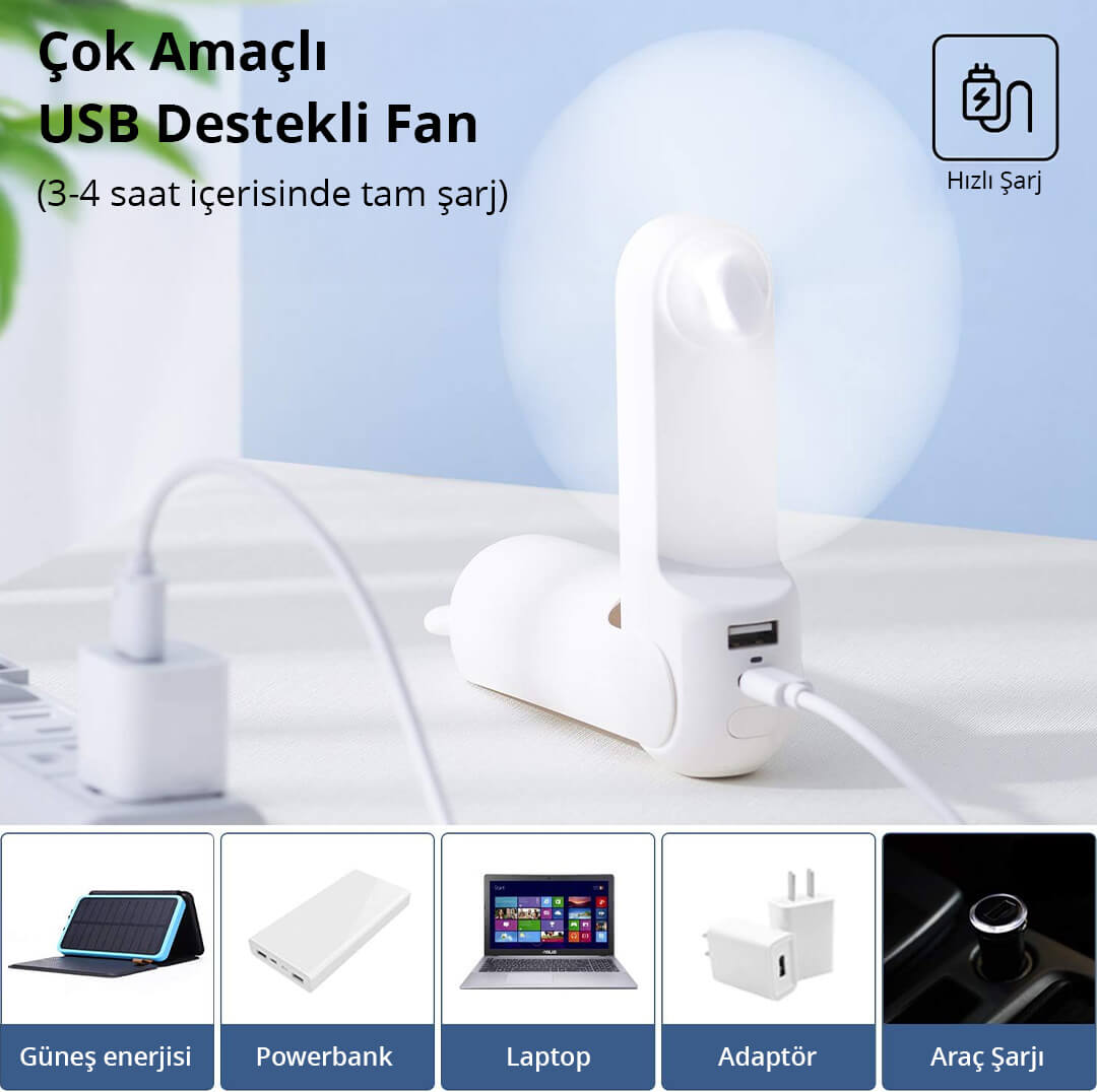 Beyaz bir USB fan kabloyla şarj oluyor, güneş paneli, powerbank, laptop, adaptör yanında.