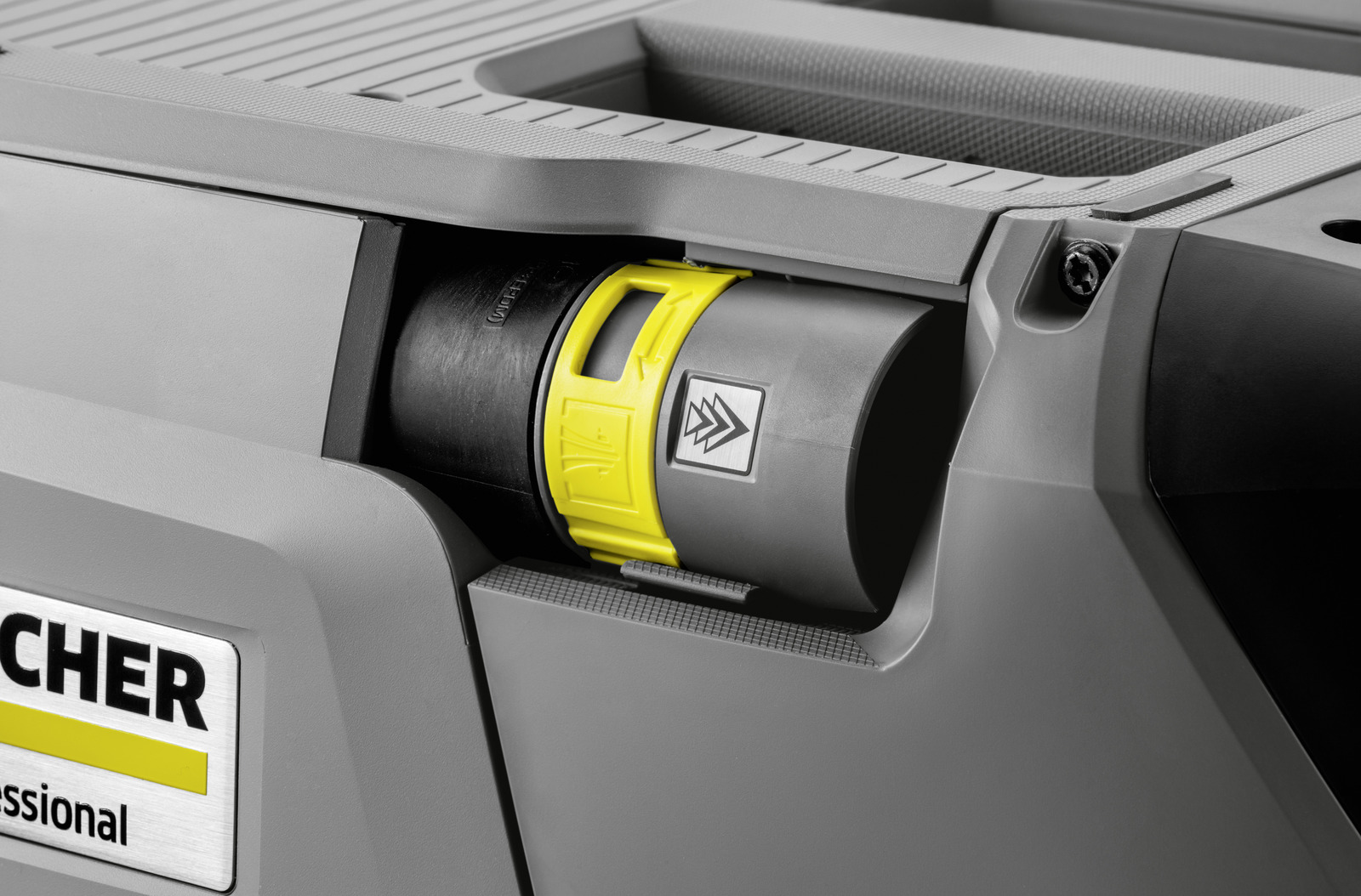 Gray Karcher cleaner with yellow locking lever and arrow symbol.