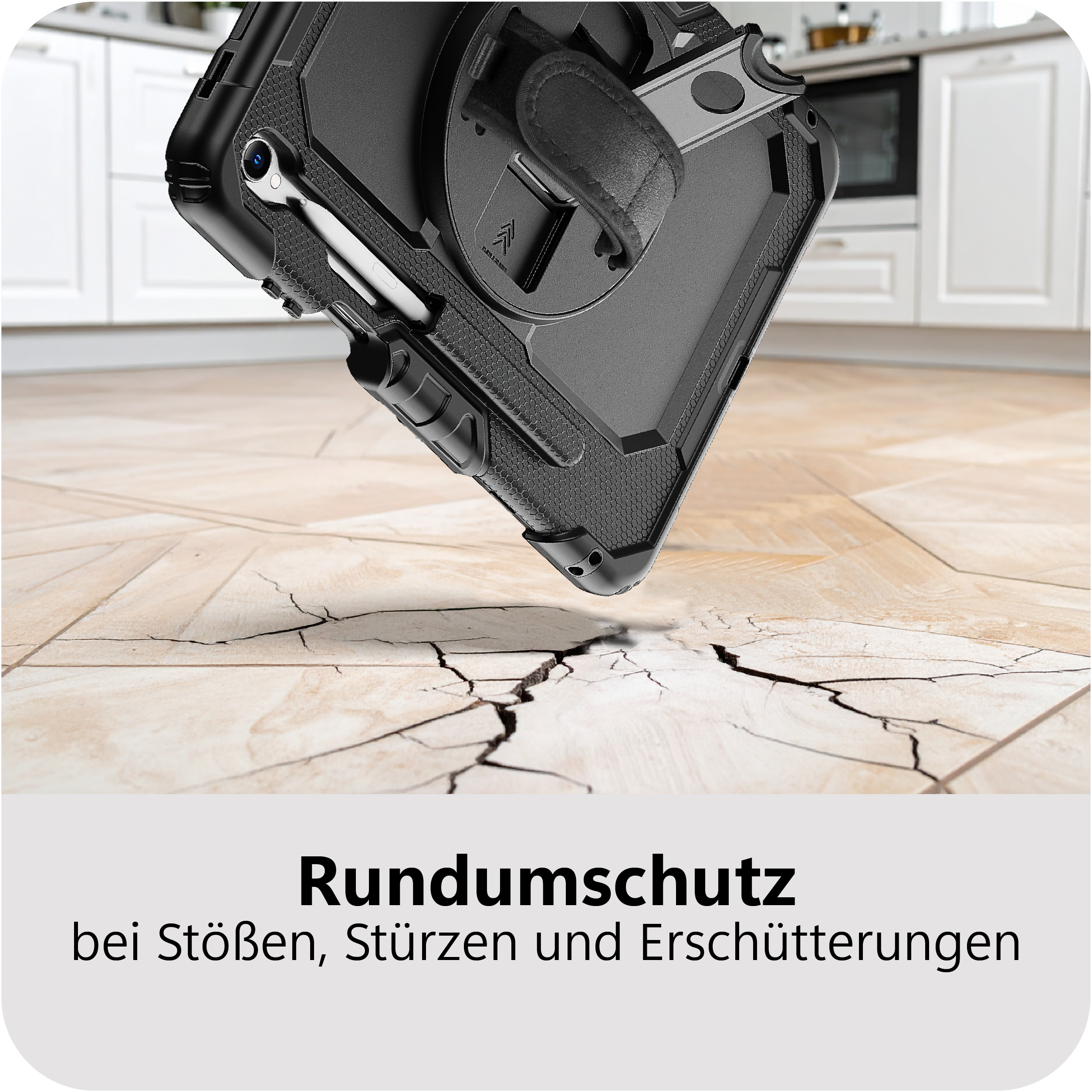 Schwarzes Tablet mit robustem Gehäuse fällt auf rissigen Boden.
