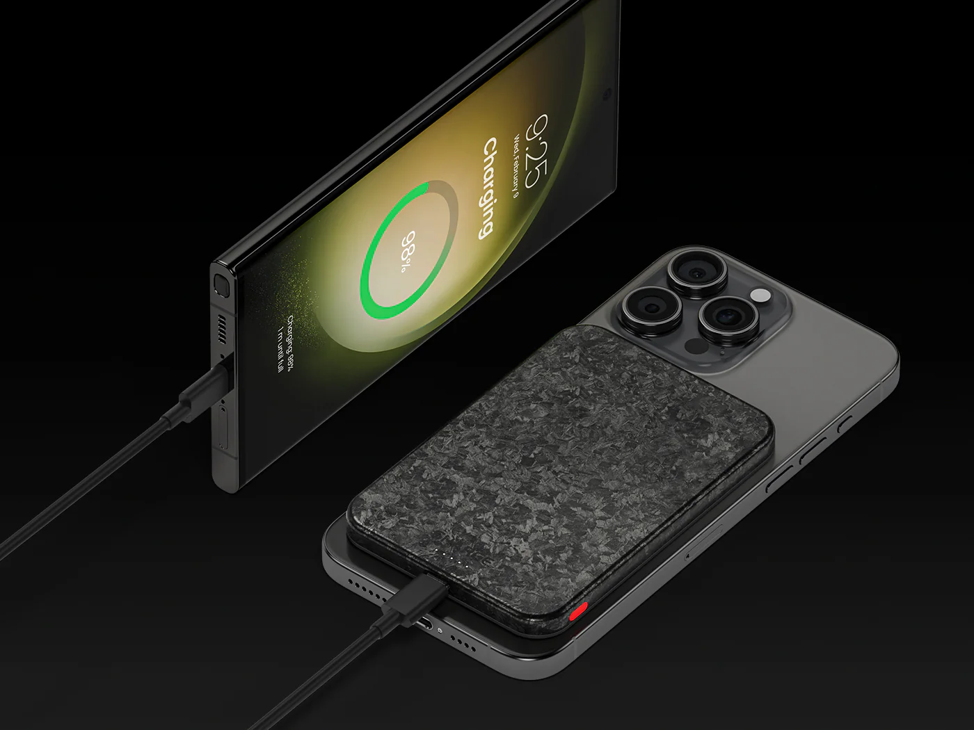 Un smartphone se charge, à côté un téléphone avec câble.