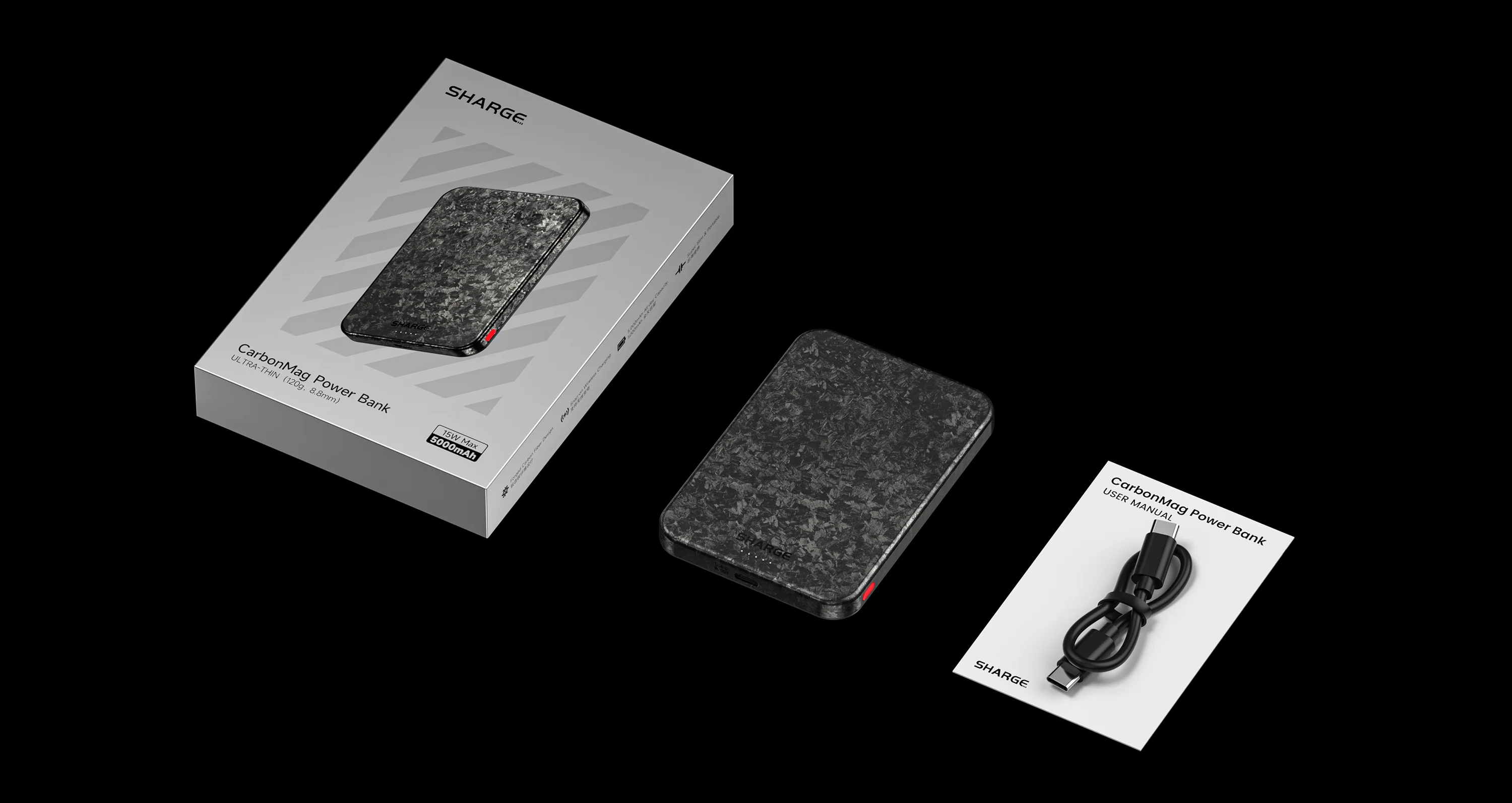 Une Power Bank CarbonMag avec câble et manuel sur fond noir.