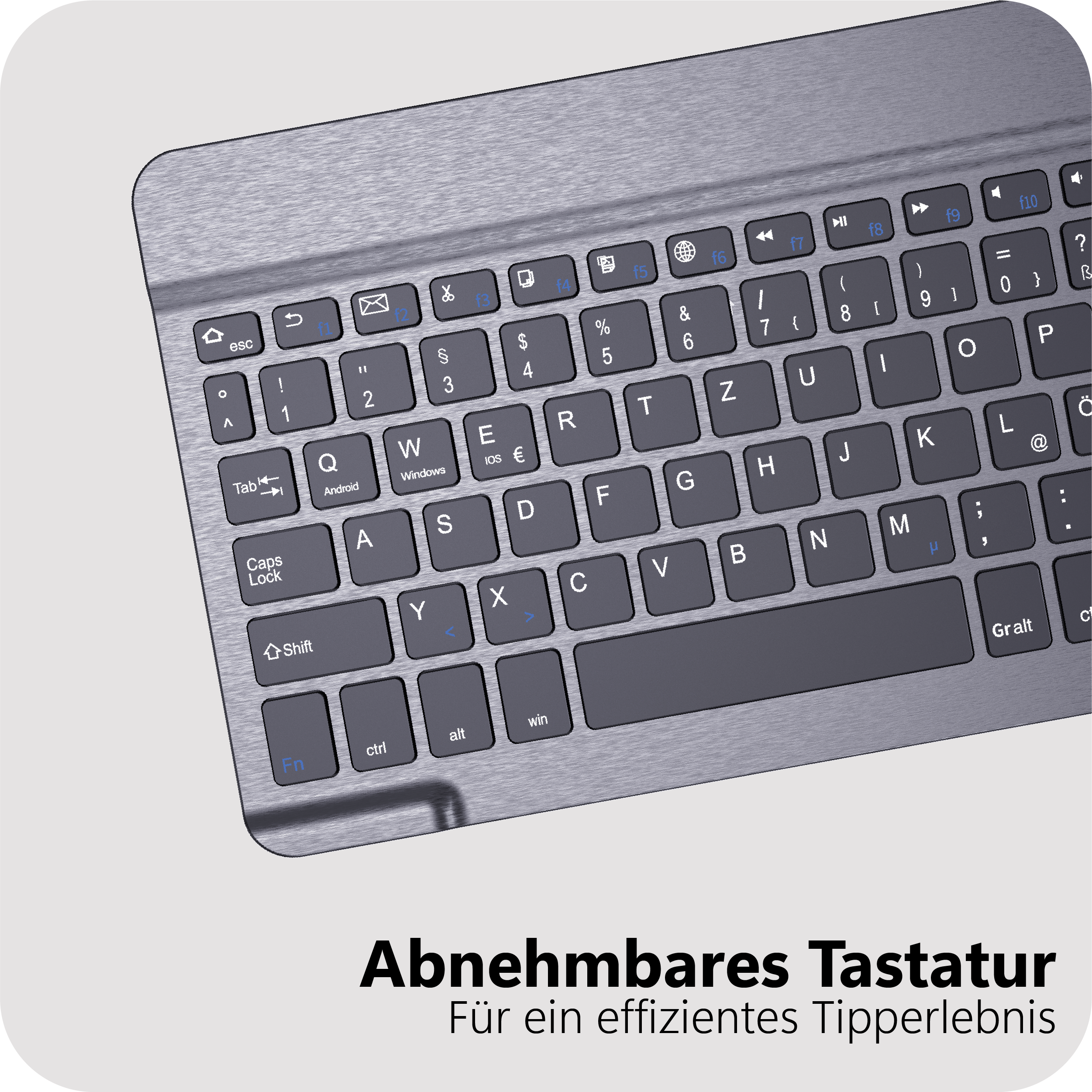 Nahaufnahme einer grauen Tastatur mit deutschen Beschriftungen und Metalloberfläche.