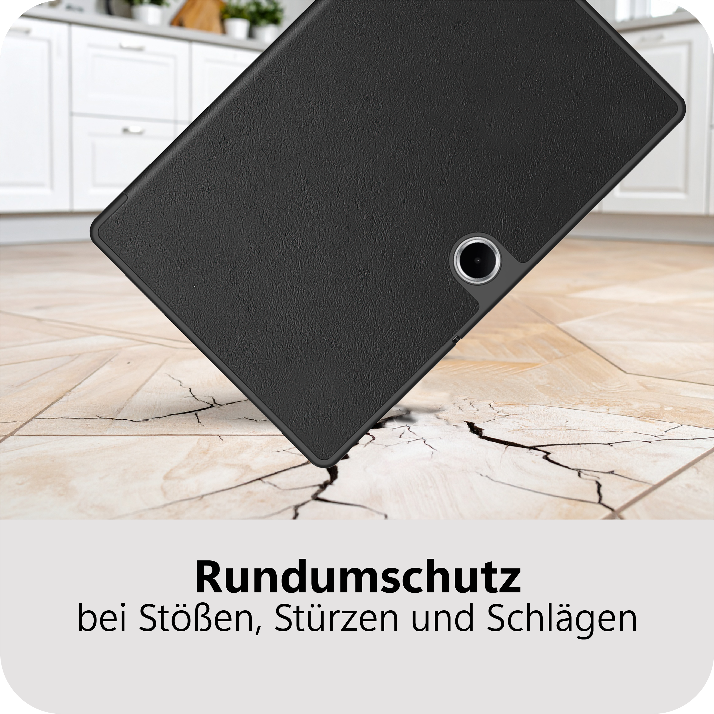 Schwarzes Tablet fällt auf Rissboden, Küche im Hintergrund.