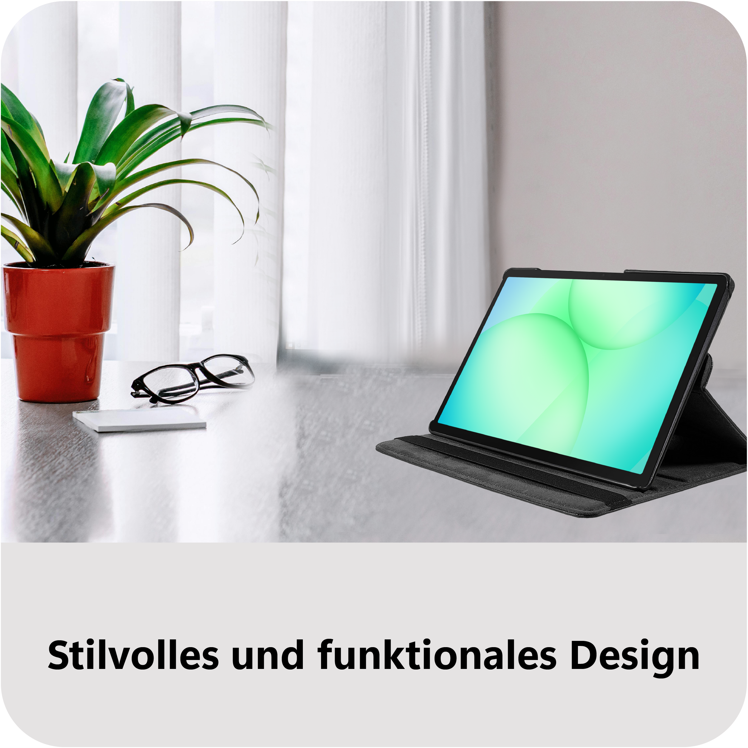 Ein Tablet mit einem stilvollen schwarzen Gehäuse steht auf einem Tisch neben einer Pflanze.