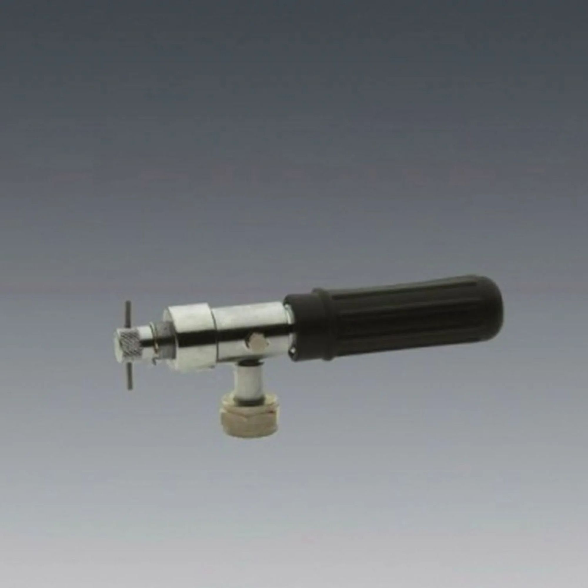A metallic tap with a black handle and a knurled knob.