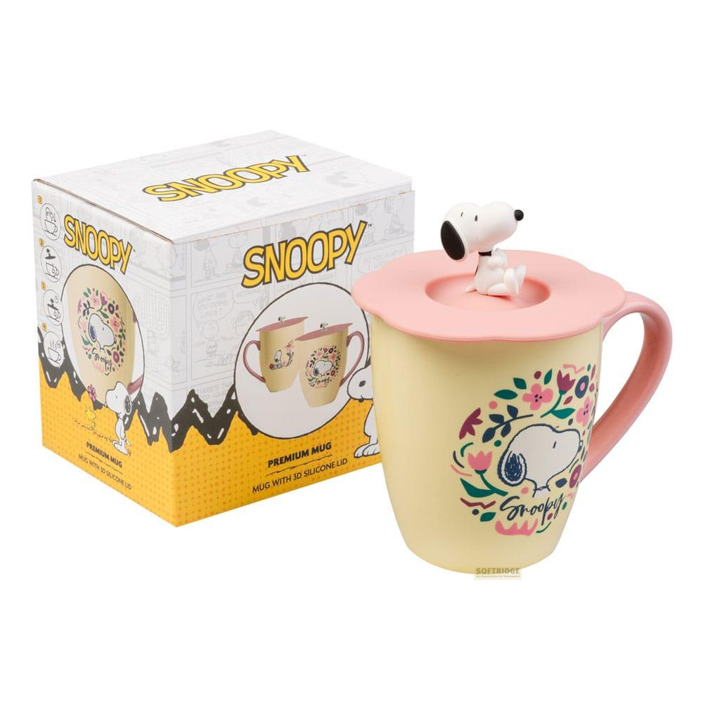 Gelbe Snoopy-Tasse mit rosa Deckel und Snoopy-Figur. Blumenmuster.
