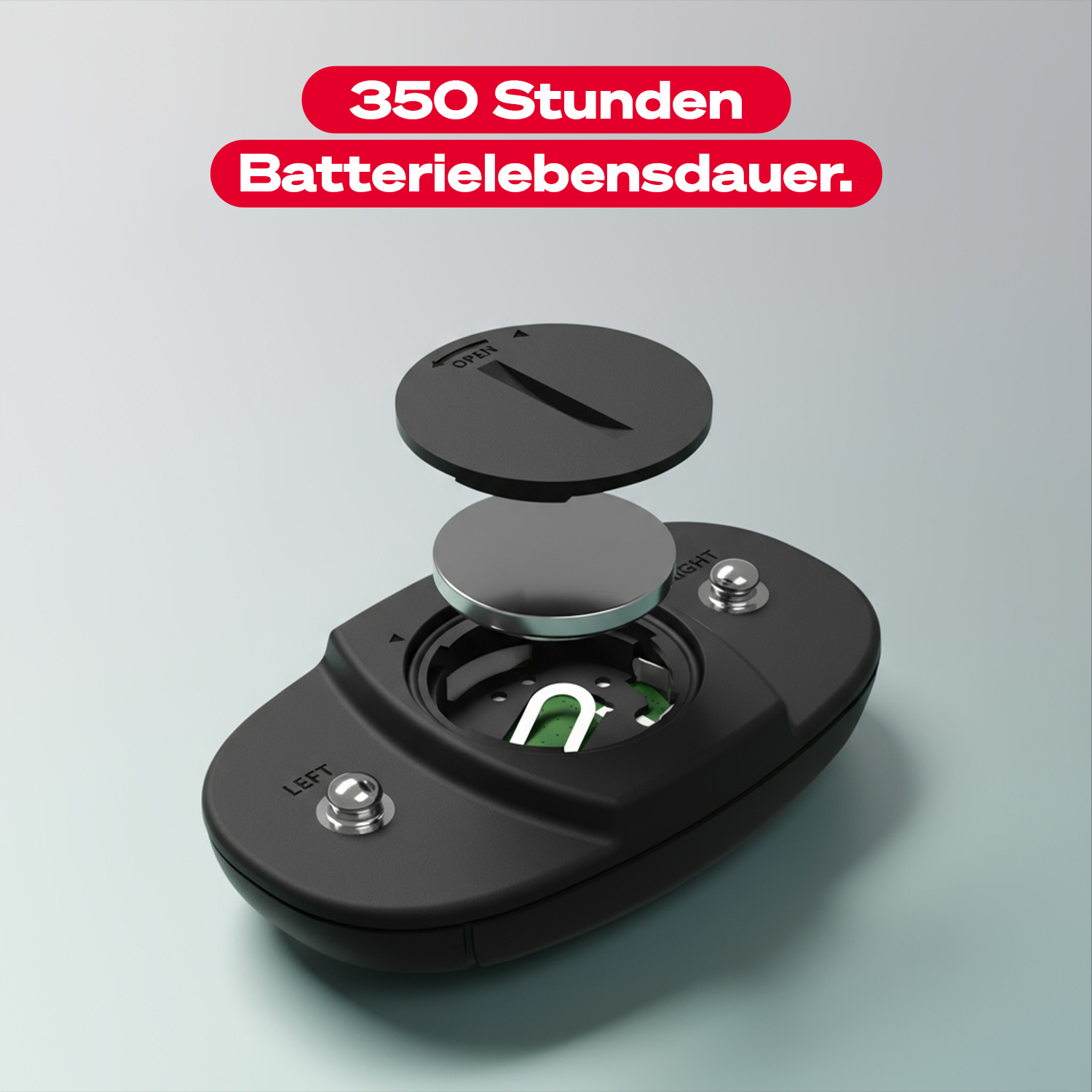 Ein schwarzes Gerät mit einer Knopfzelle und einem offenen Deckel.