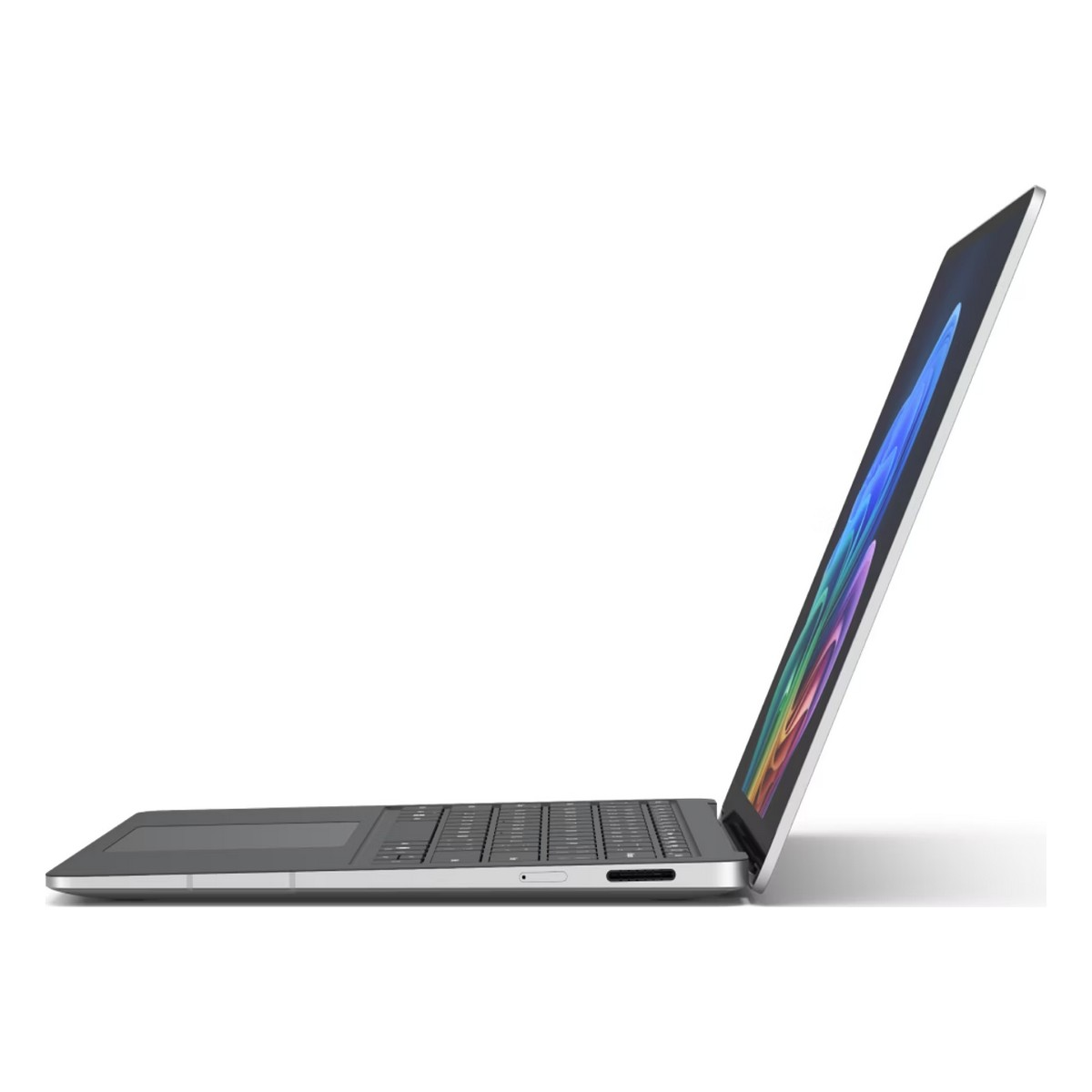 Un laptop argentato con lo schermo aperto, che mostra un motivo colorato.