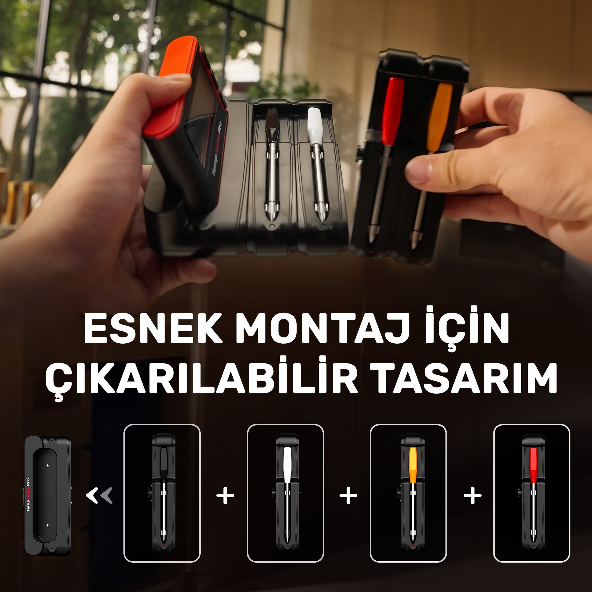 Kırmızı ve siyah, çıkarılabilir problu bir cihazı tutan eller.