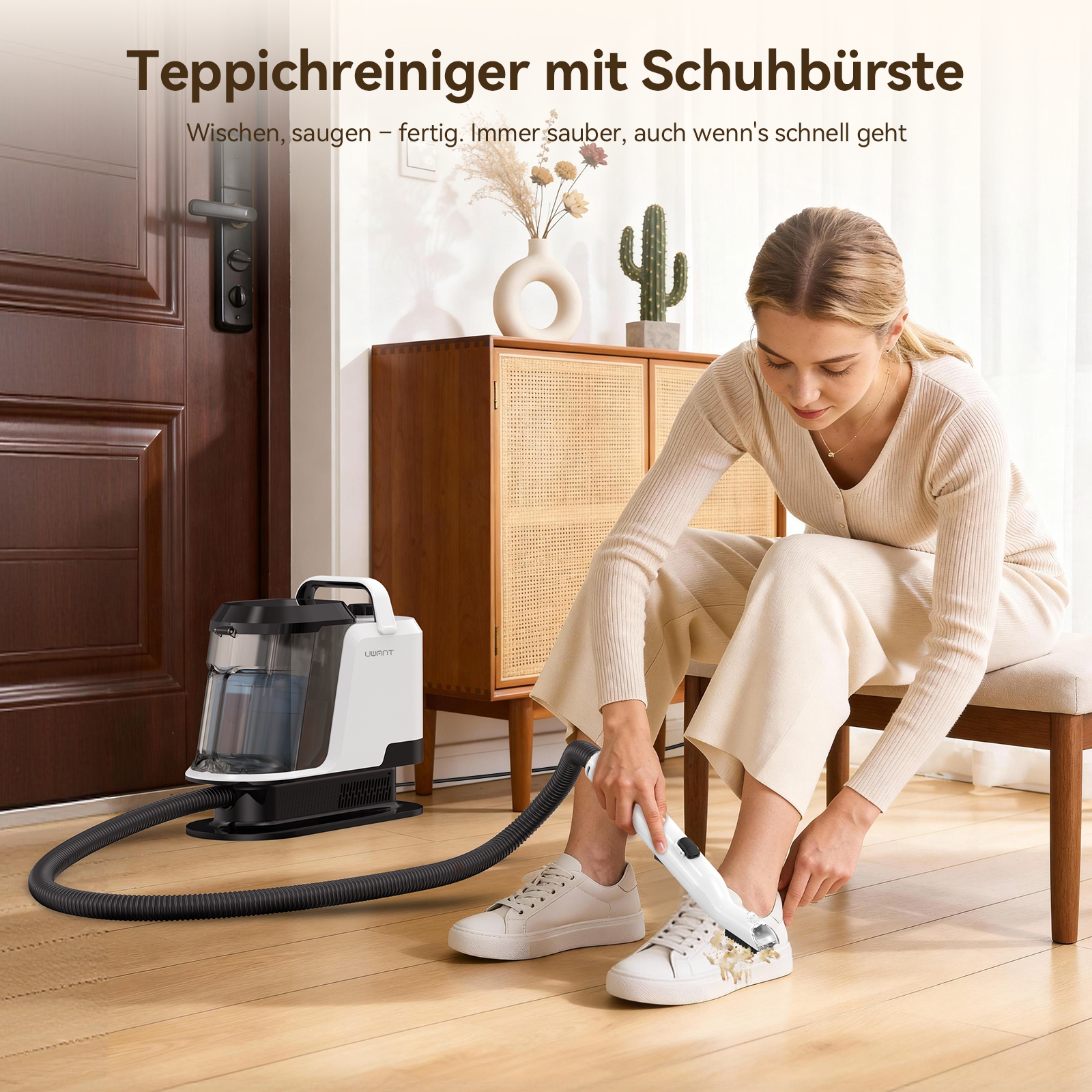 Une femme nettoie des baskets blanches avec un appareil de nettoyage blanc près d'une porte marron.