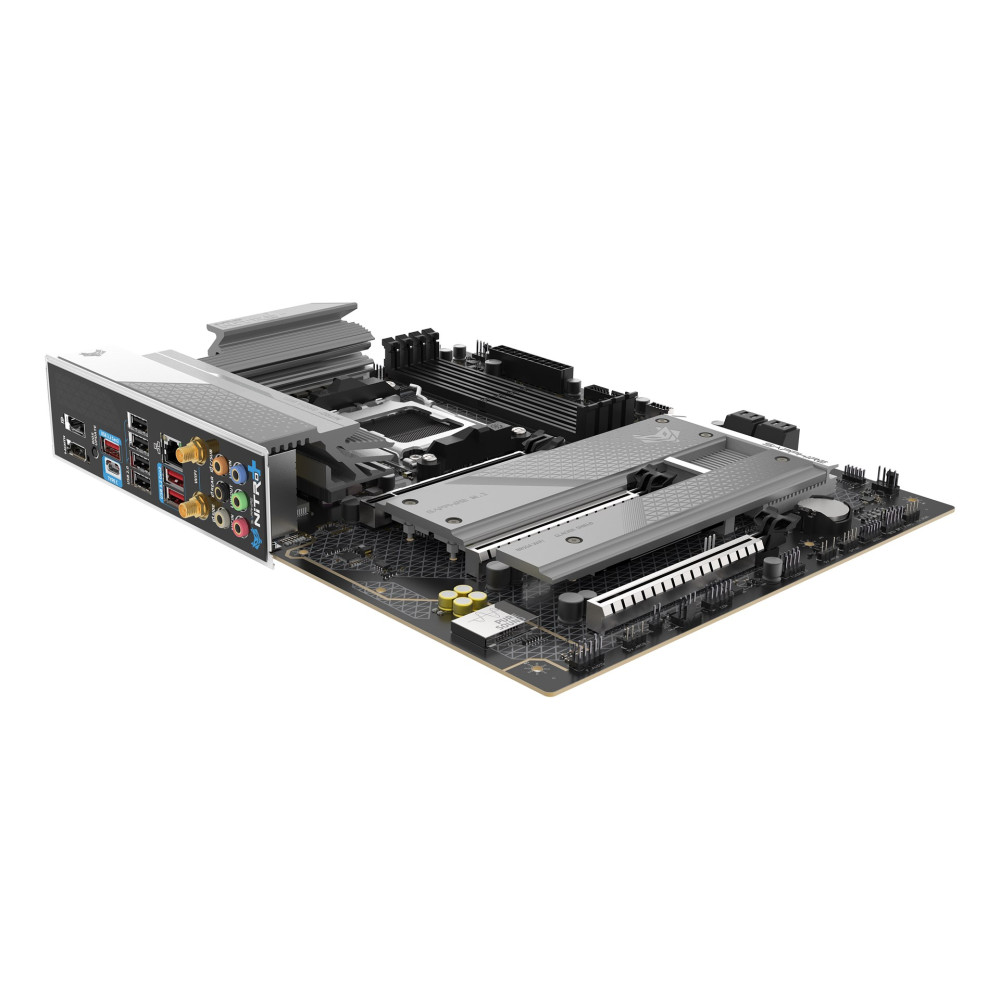 Szczegółowy widok płyty głównej komputera z portami, radiatorami i gniazdami.