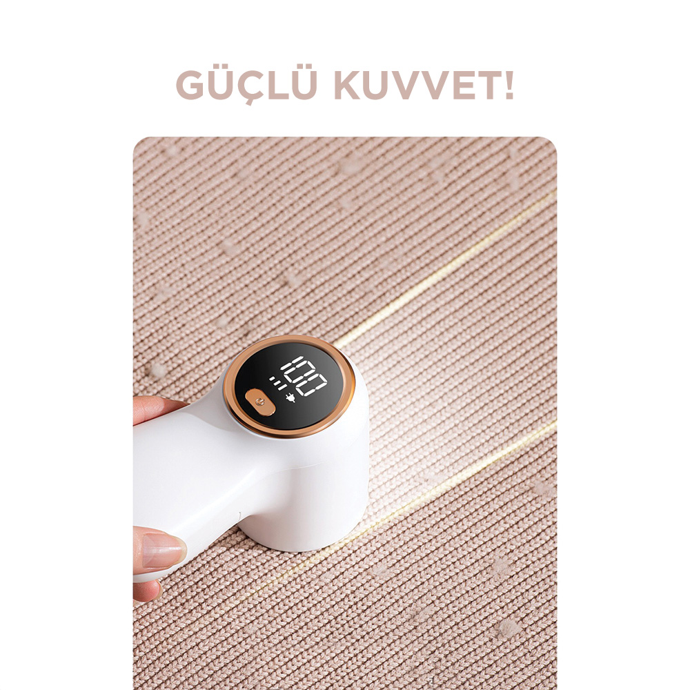 Bej rengi kumaş üzerinde '100' dijital göstergeli beyaz kumaş tüy giderici.