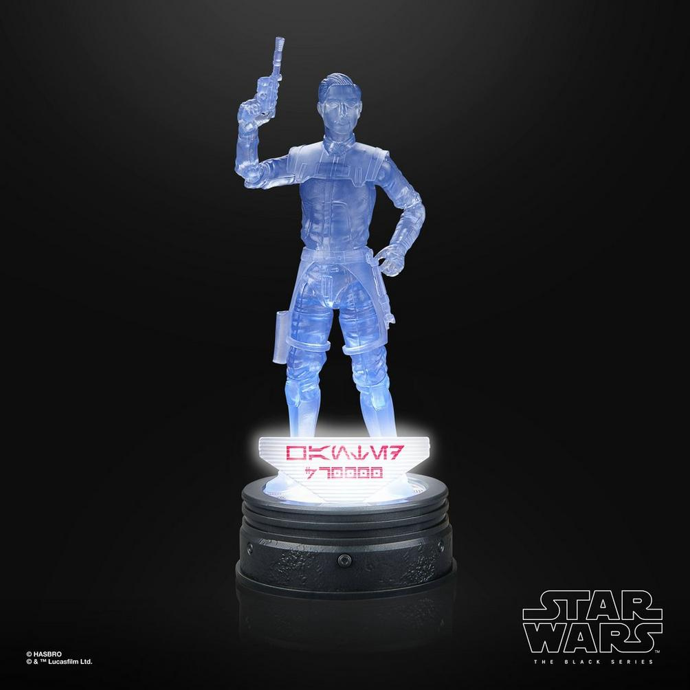 Figura transparente azul de Star Wars con pistola, sobre base iluminada con texto alienígena.