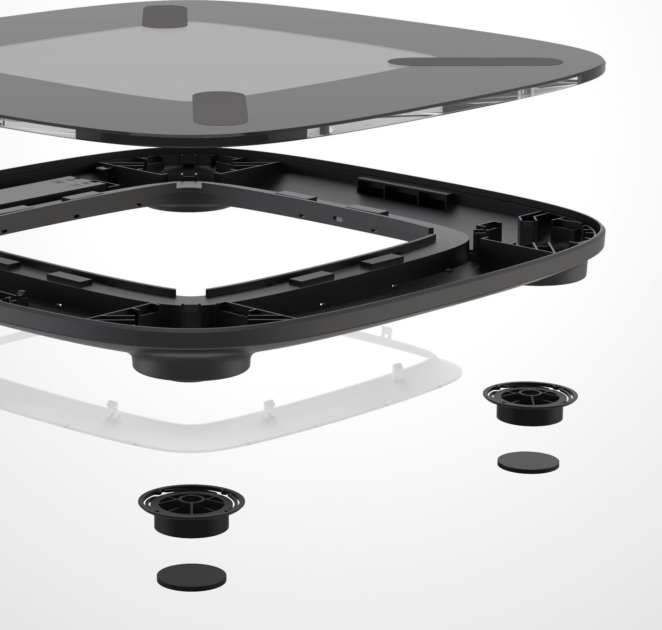 Widok rozstrzelony czarnej wagi ze szklanym blatem i stopkami.