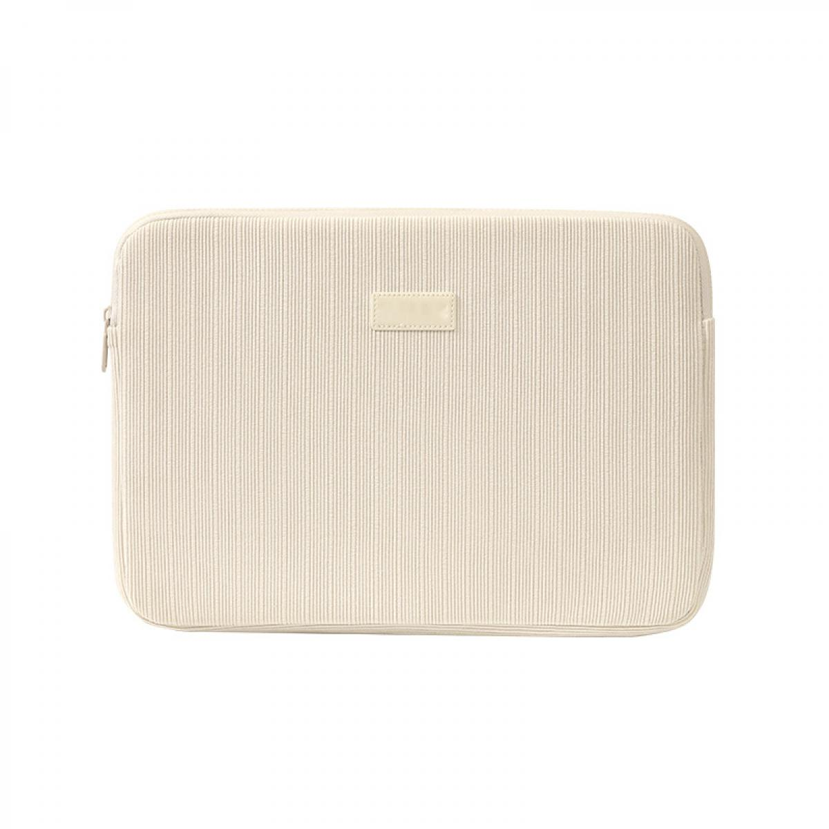 Eine cremefarbene Laptoptasche mit vertikalen Rippen und einem kleinen Lederetikett.
