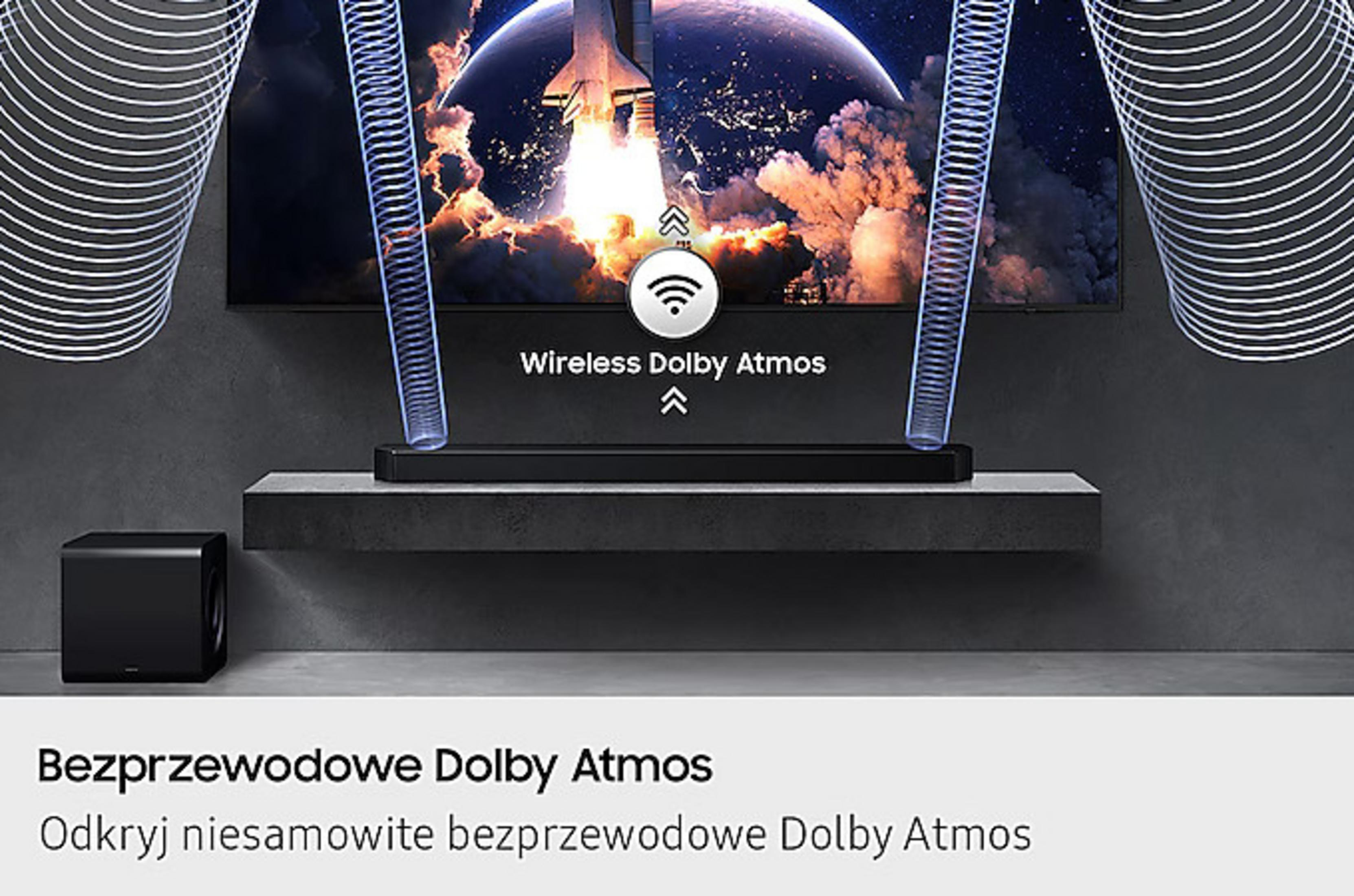 A black subwoofer and soundbar in front of a TV showing a rocket launch.