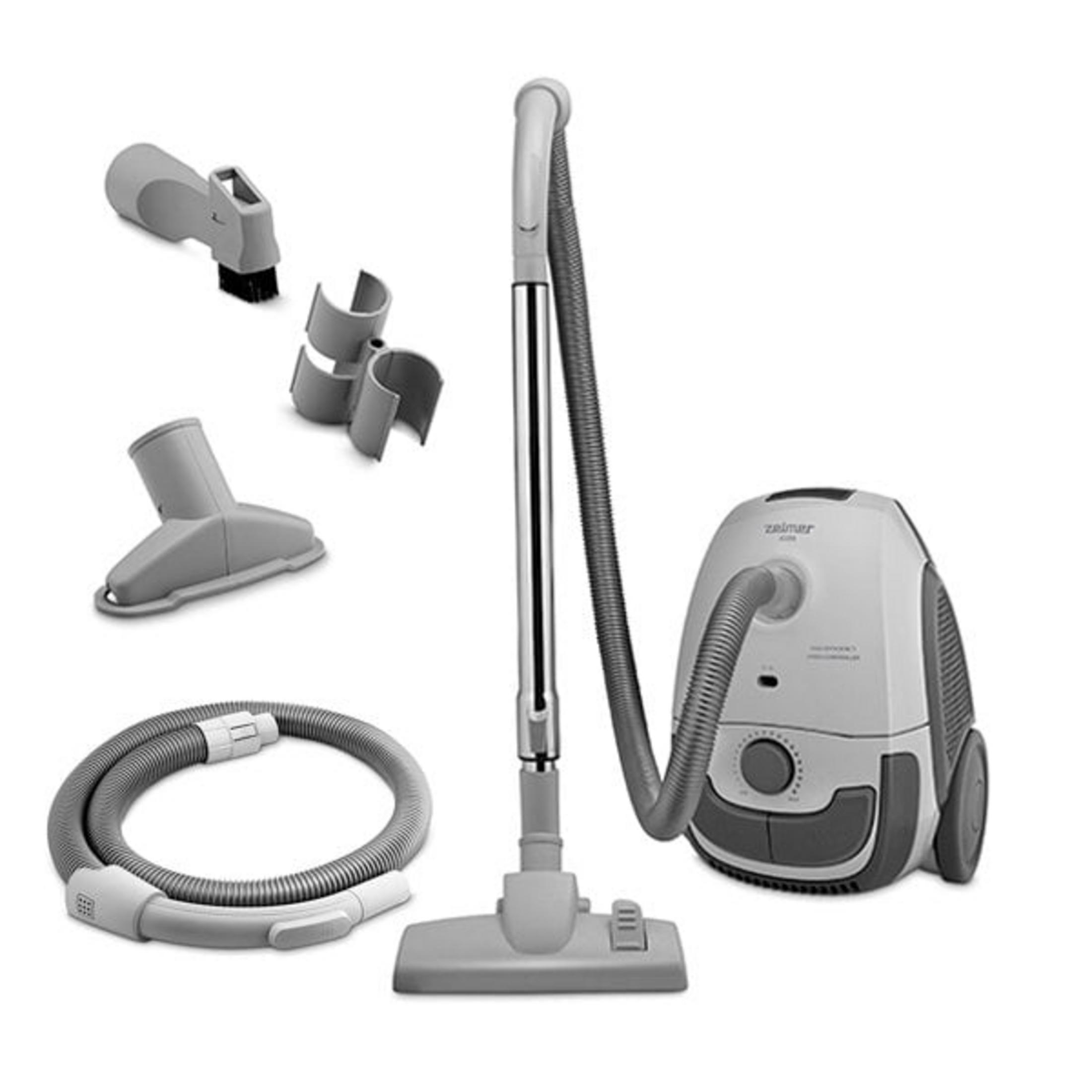 Gray vacuum cleaner with accessories: hose, tube, brush, crevice tool.