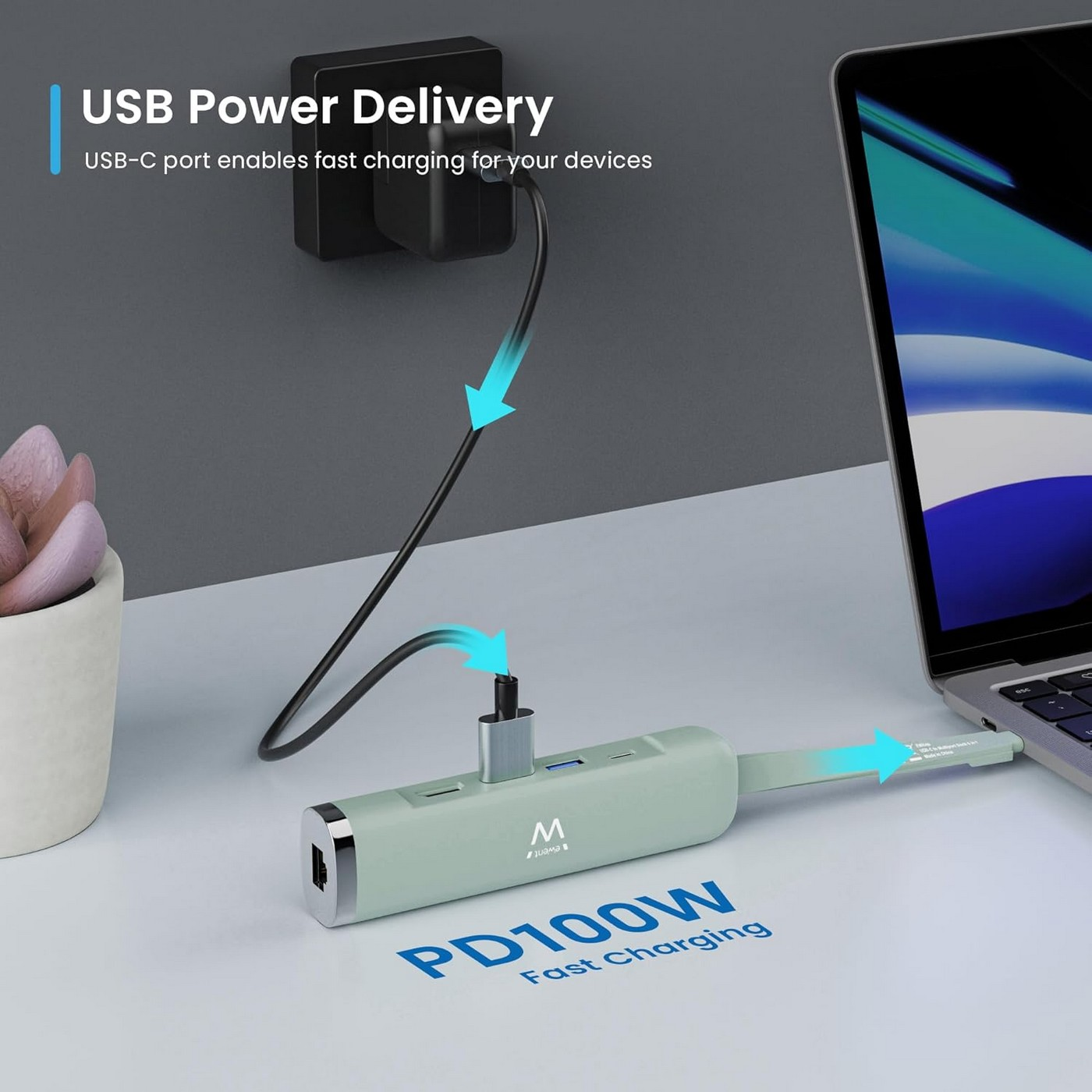 Un hub USB-C verde chiaro carica un laptop. Un alimentatore carica l'hub.