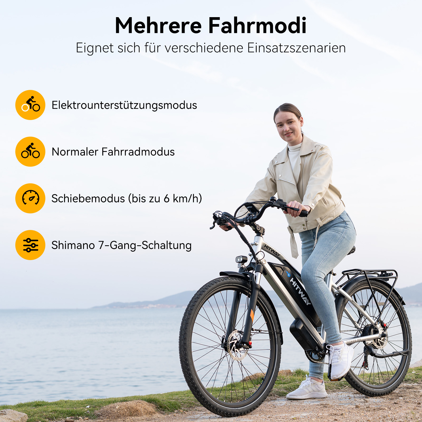 Frau fährt E-Bike am Meer mit Fahrmodi-Optionen daneben.