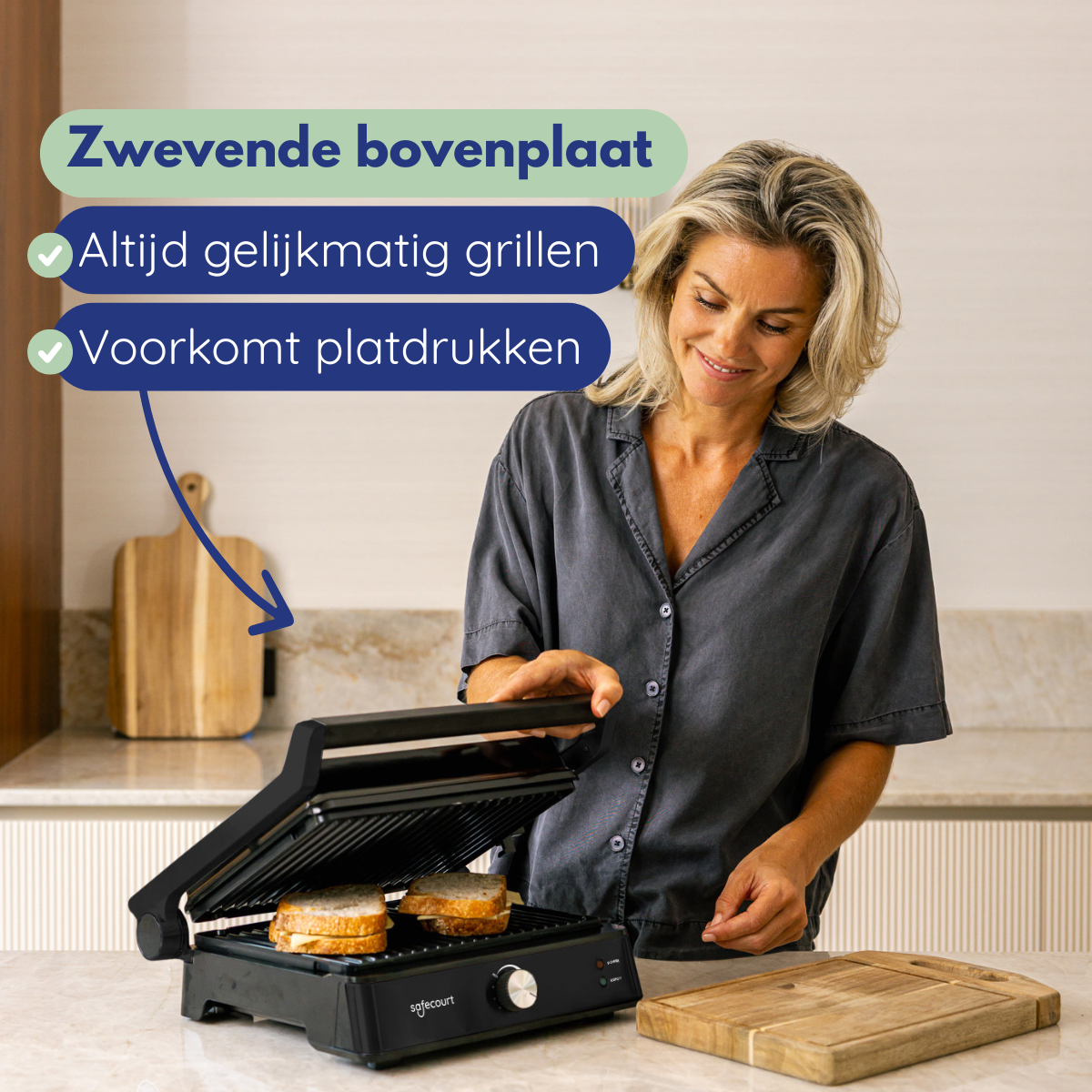 A woman with blonde hair uses a sandwich maker to toast sandwiches.