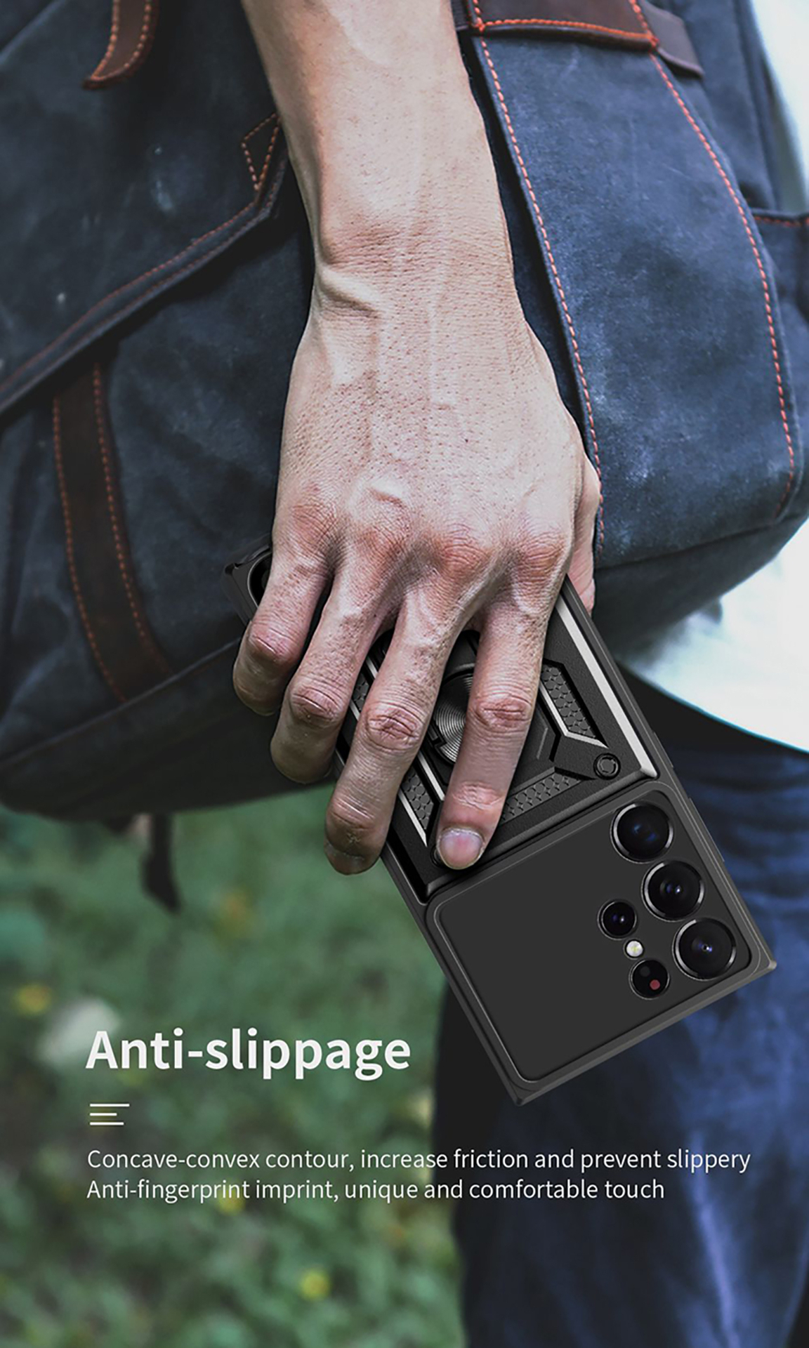 Un homme tient un téléphone noir avec étui protecteur et anneau. Fond flou.