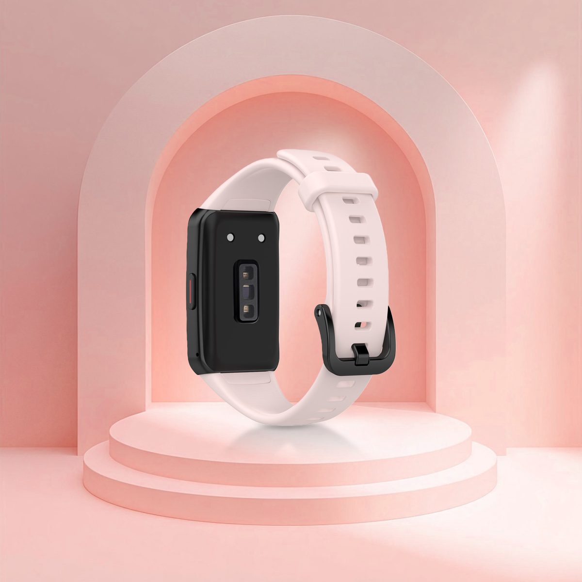 Ein weißes Fitnessarmband mit schwarzem Gehäuse, das auf einer rosa Bühne steht.