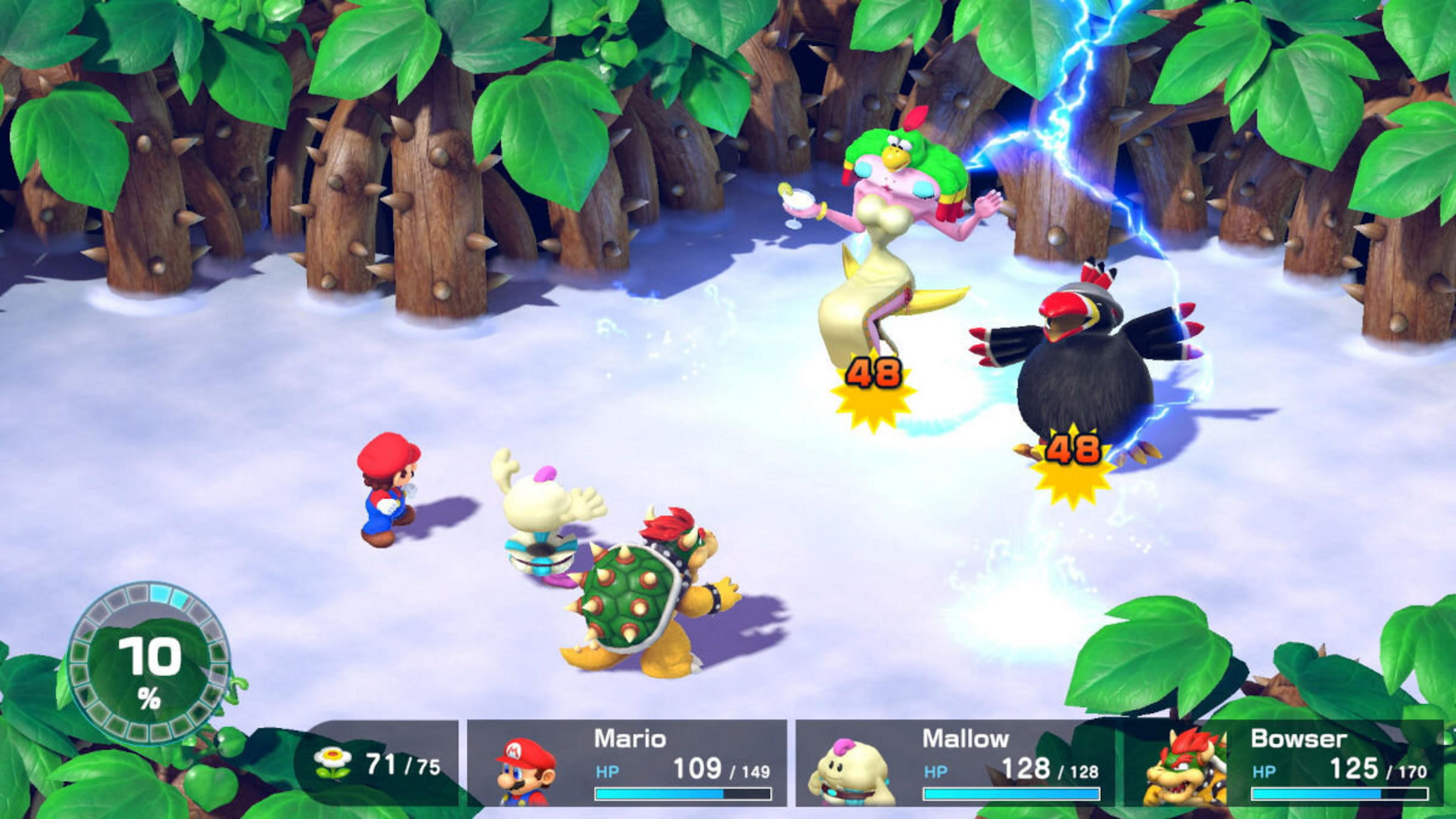 Mario, Bowser e Mallow combattono due nemici in un bosco innevato.