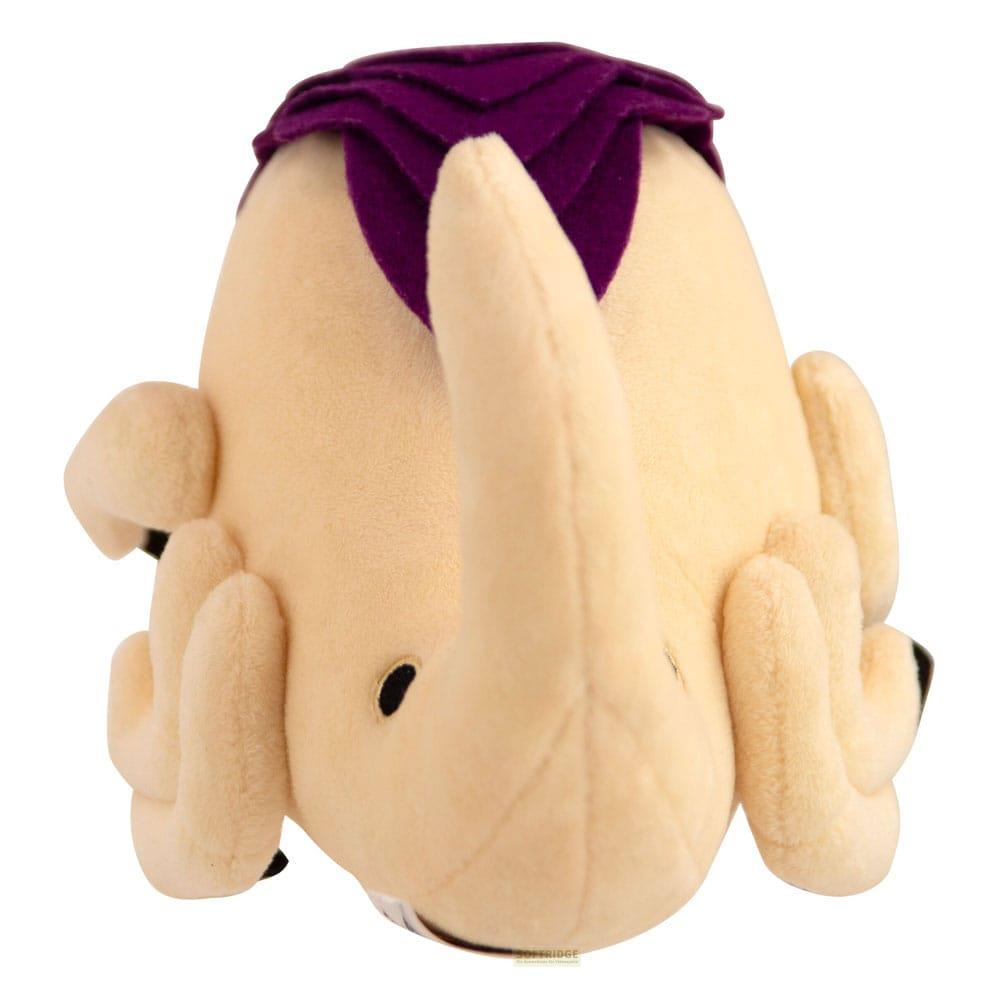 Un peluche beige con copricapo viola e muso lungo.