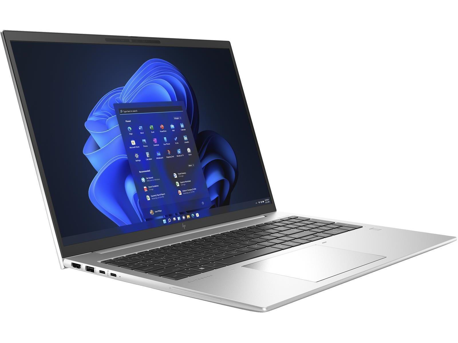 Ein silberner Laptop mit geöffnetem, beleuchtetem Bildschirm, der eine blaue Wellen-Hintergrundgrafik zeigt.