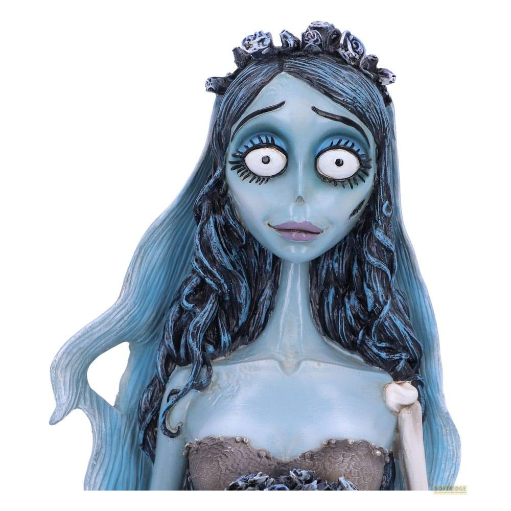 Eine blauhäutige Brautfigur mit dunklem Haar, einem Schleier und einem Hochzeitskleid.