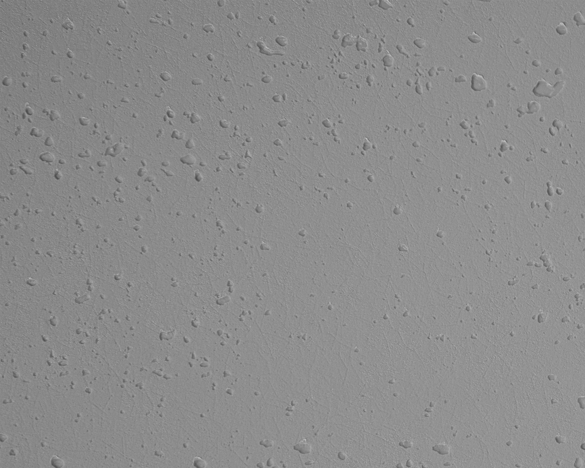 Grauer Hintergrund mit vielen kleinen Wassertropfen.
