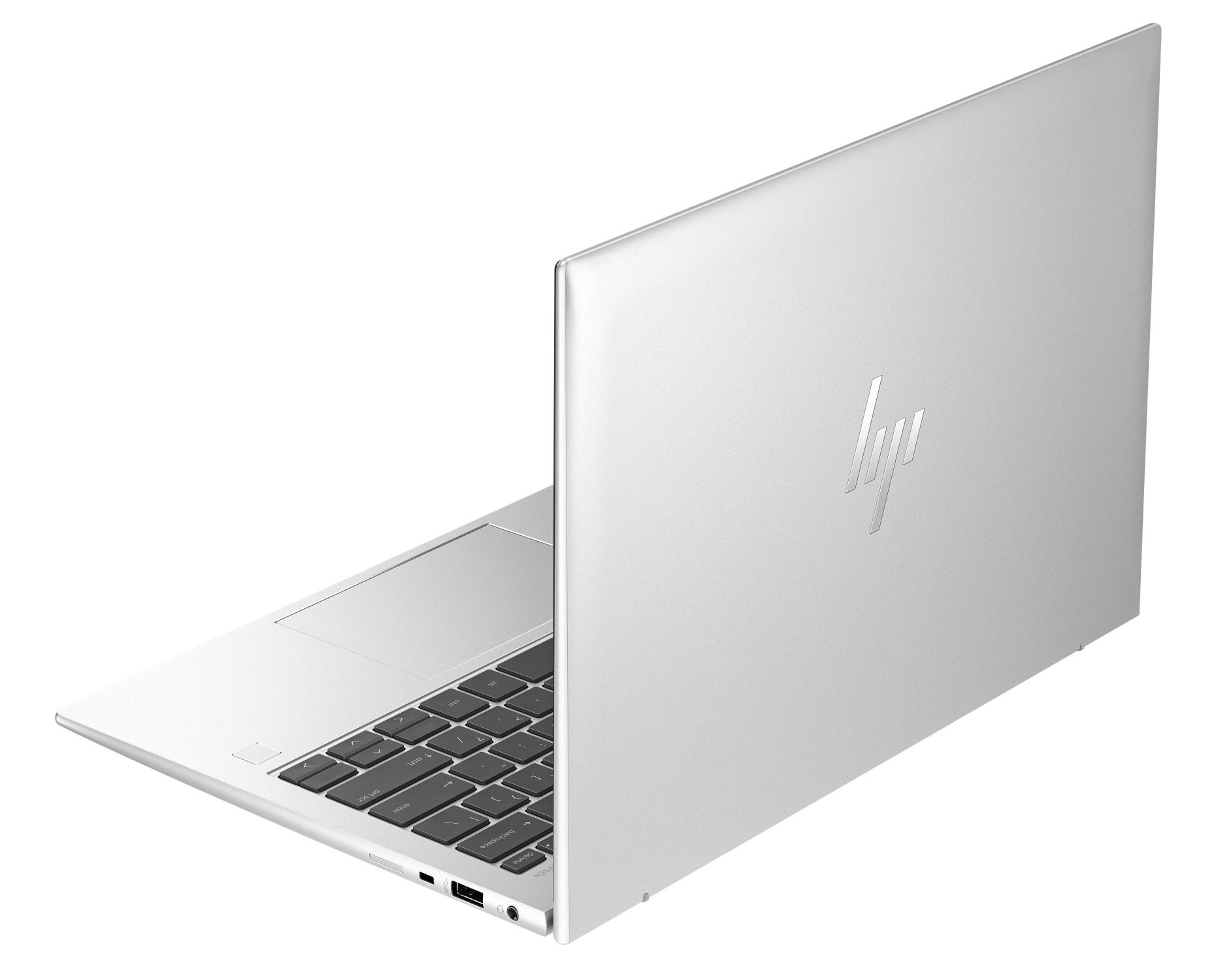 Ein silberner HP Laptop, teilweise geöffnet, mit Tastatur und Touchpad.