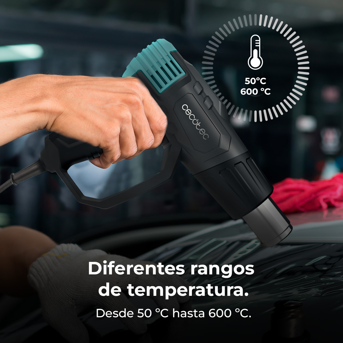 Mano tiene una pistola termica nera con accenti turchesi. Display temperatura 50-600°C.